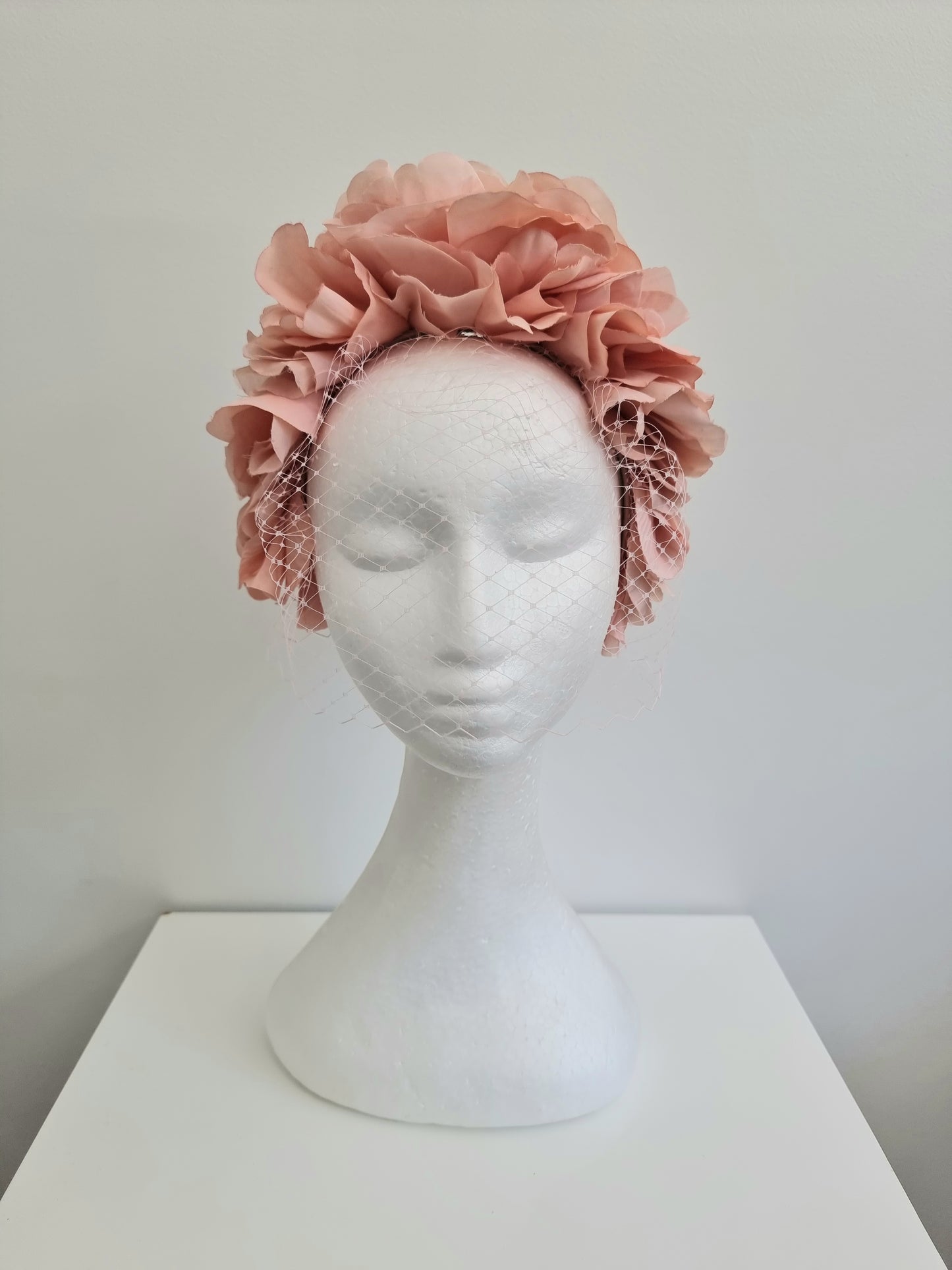 Miss Trixie. Womens ruffle embellished headband with veiling in Blush Pink