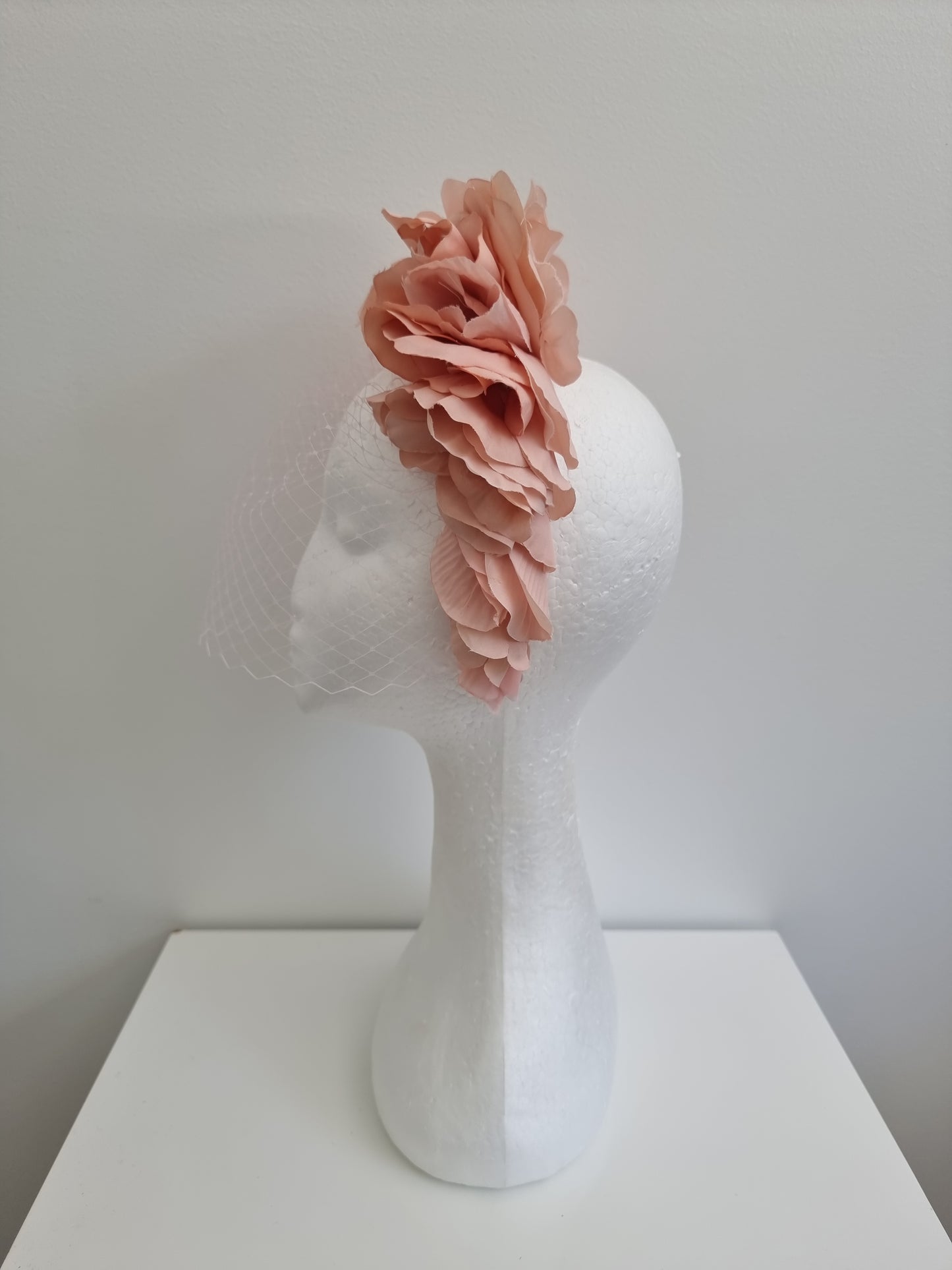 Miss Trixie. Womens ruffle embellished headband with veiling in Blush Pink