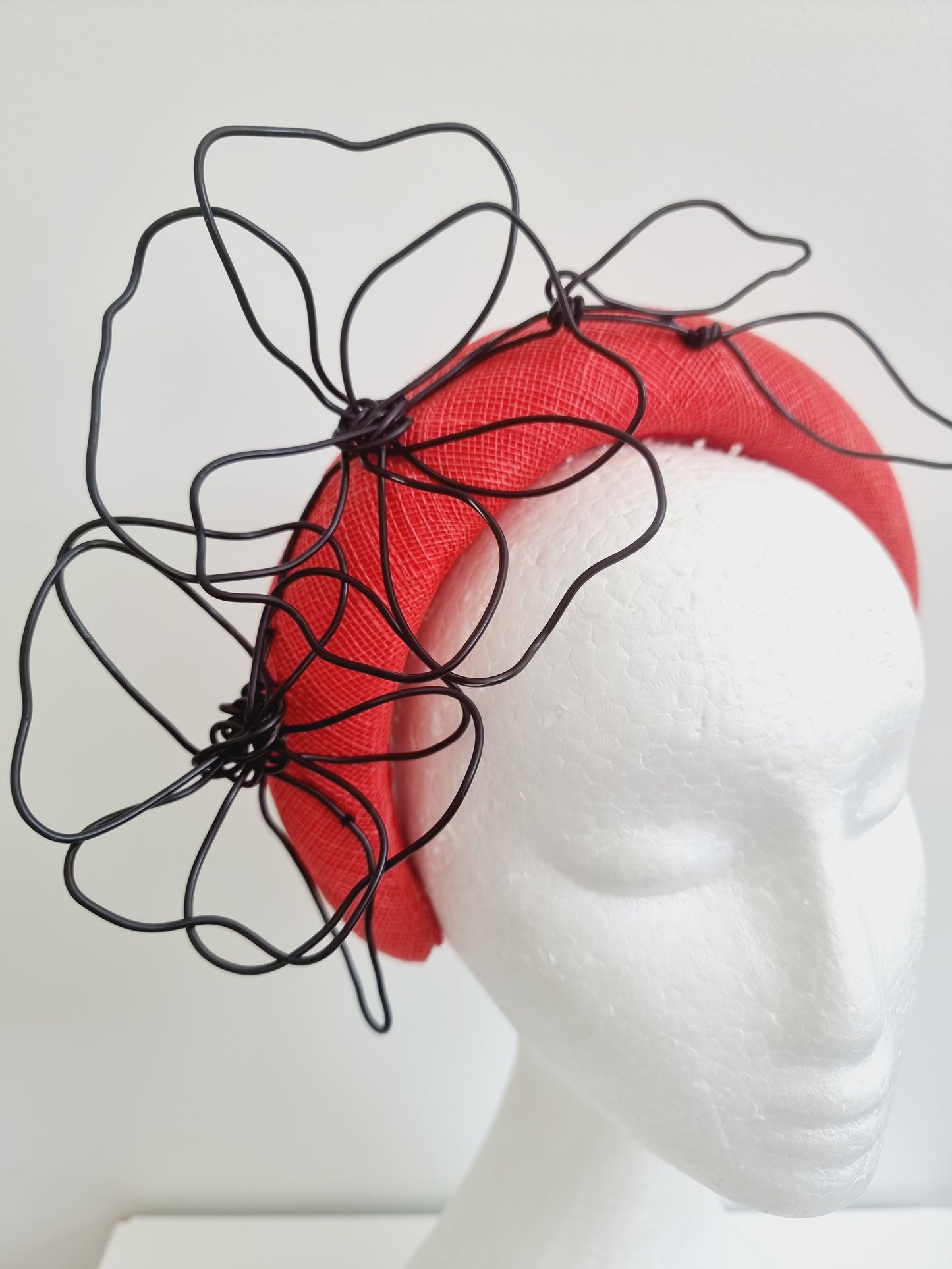 Miss Quinn. Womens Bright red sinamay padded headband and black wire flowers