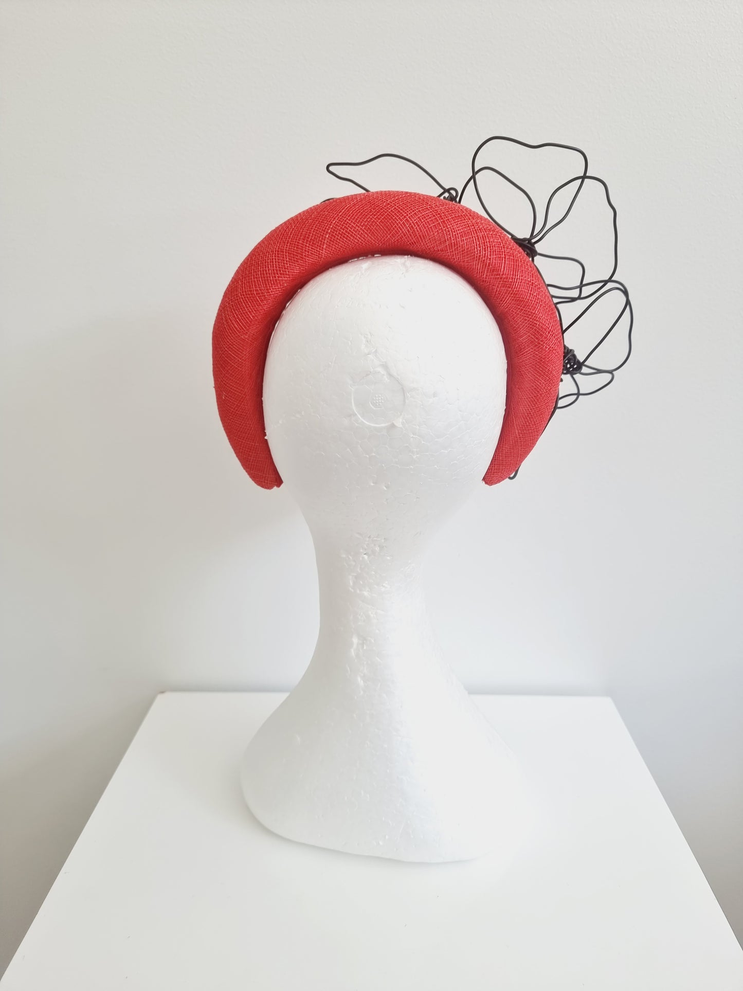 Miss Quinn. Womens Bright red sinamay padded headband and black wire flowers