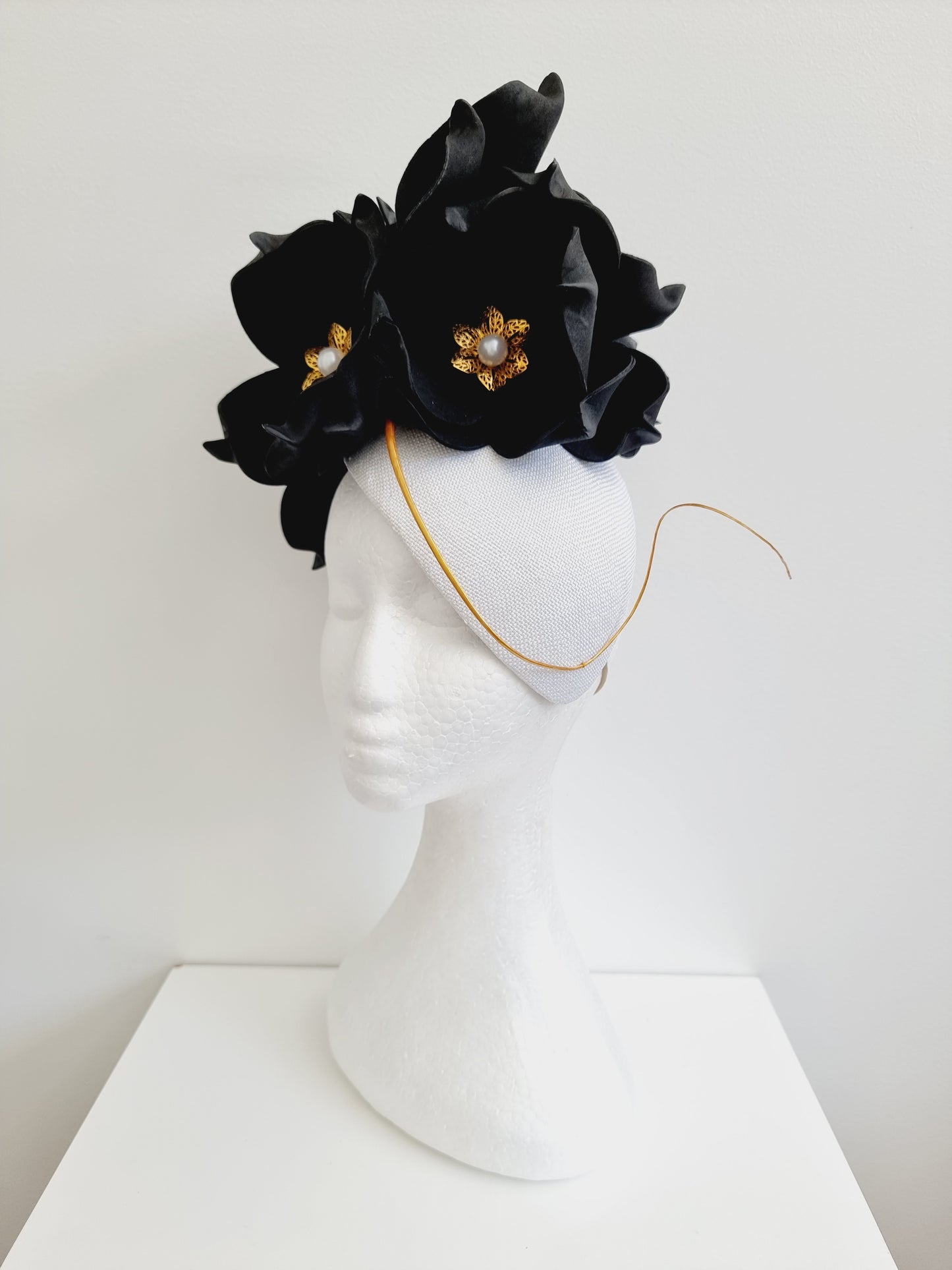 Miss June. Womens black and white fascinator with gold