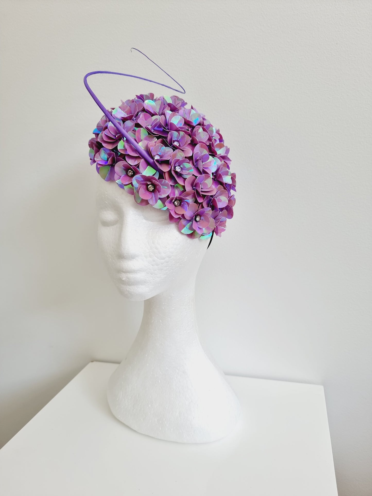 Miss Jamie . Womens mauve 3D flower encrusted fascinator with quill