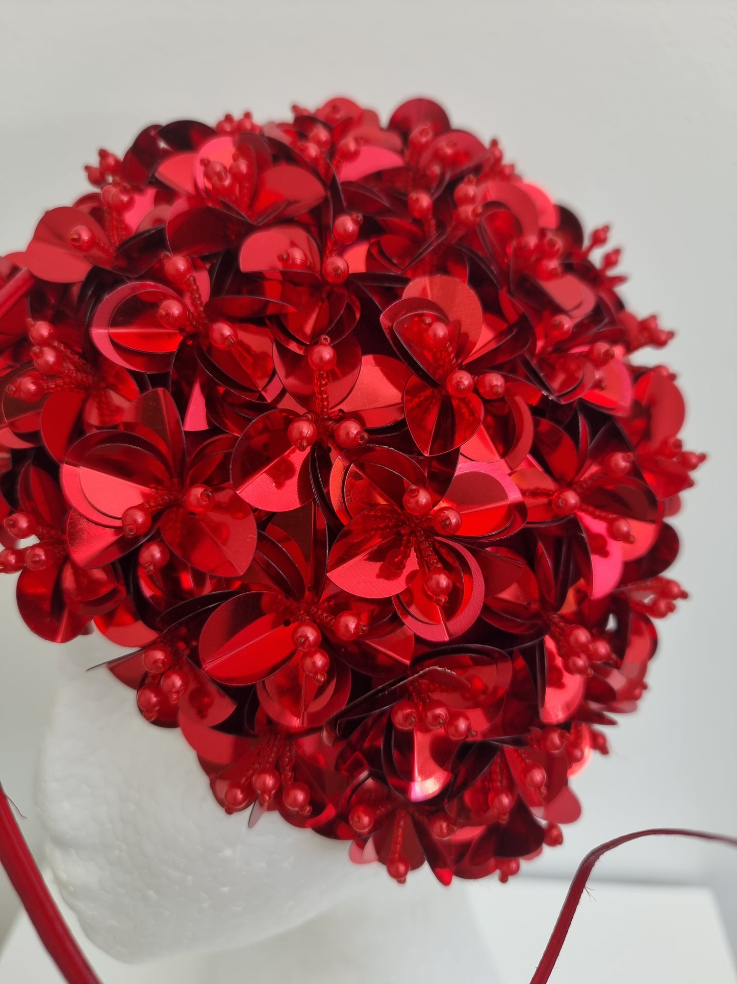 Miss Jamie . Womens Red 3D flower encrusted fascinator with quill