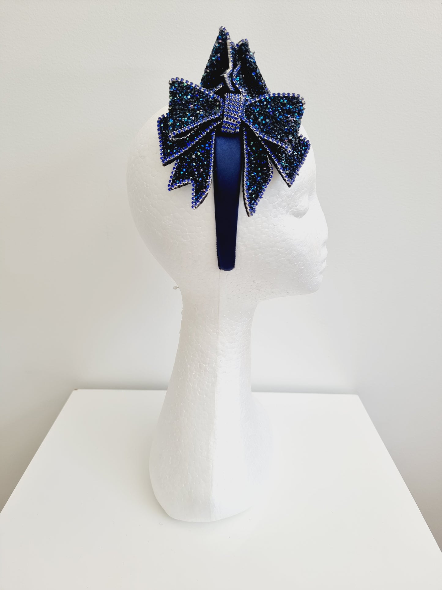 Miss Chateau. Womens Dark Blue crystal bow embellished headband