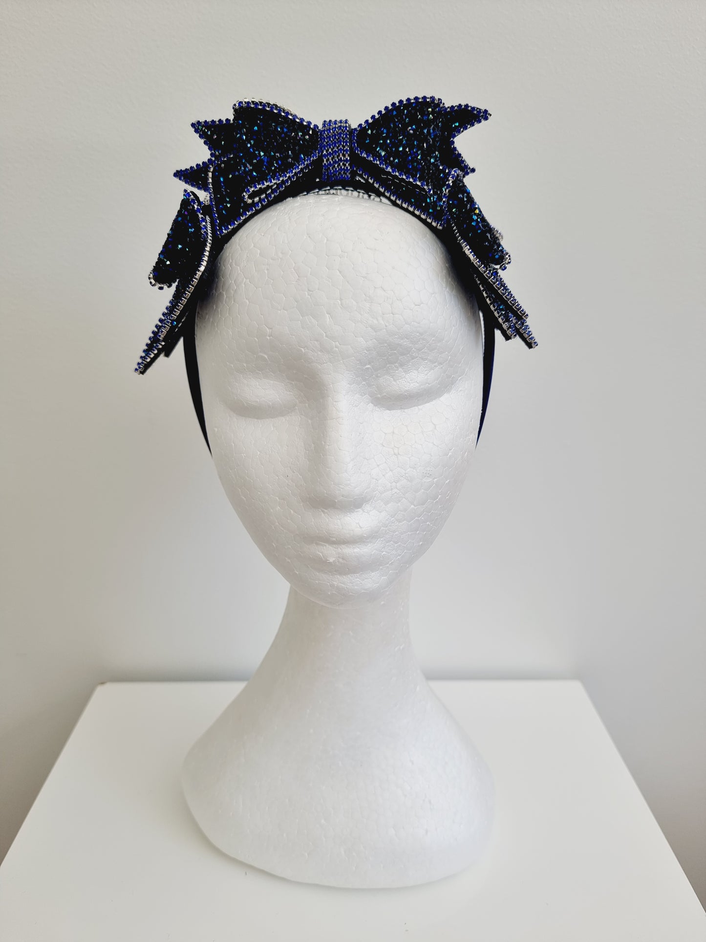 Miss Chateau. Womens Dark Blue crystal bow embellished headband