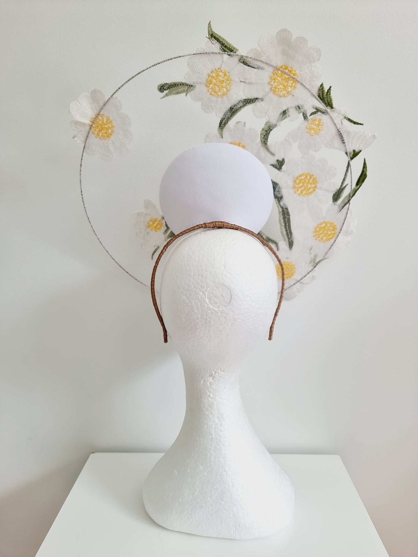 Miss Ups a Daisy. Womens white satellite percher headband fascinator with embroidered daisy