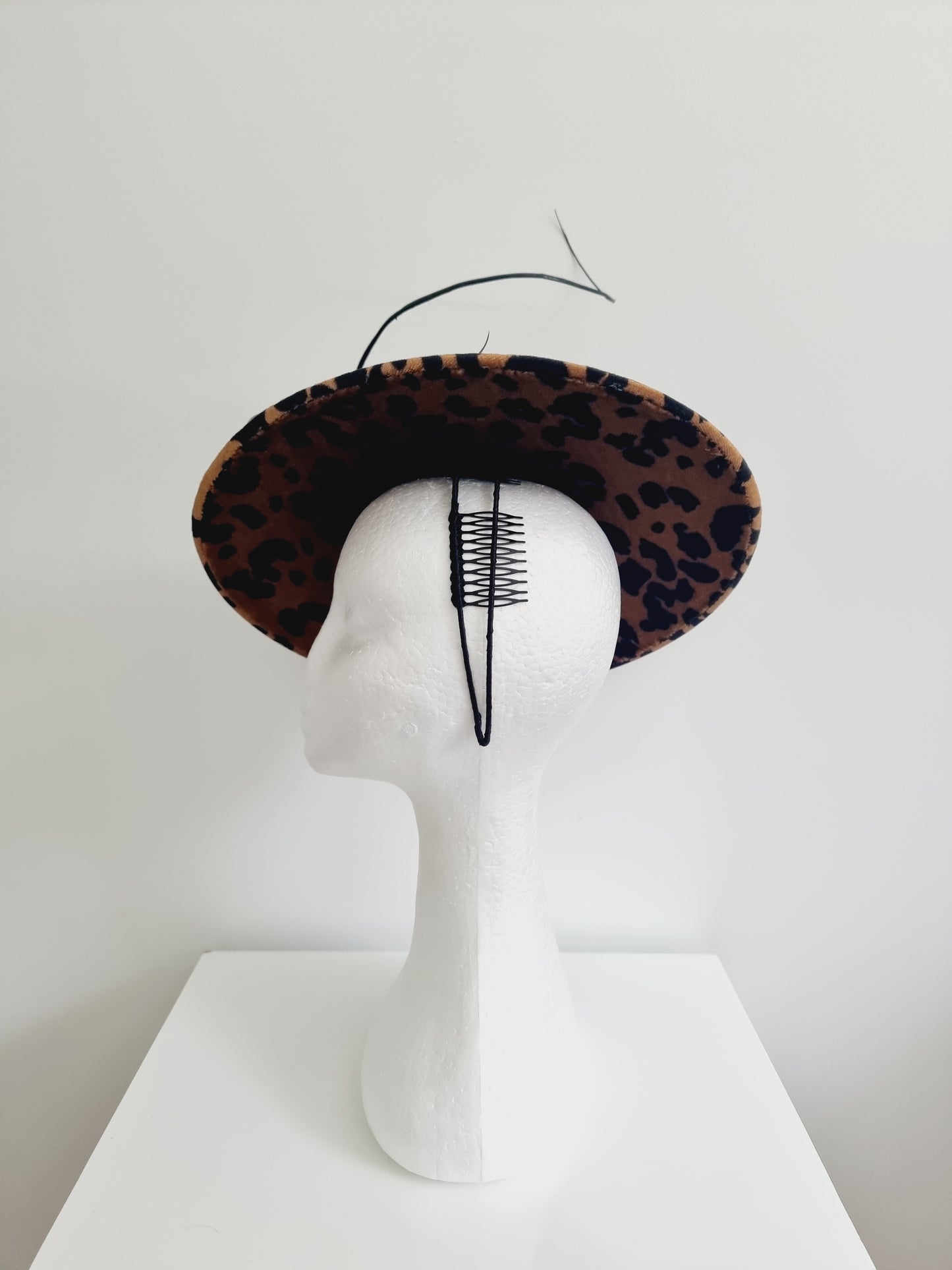 Miss Call of the wild. Womens low coolie animal print fascinator