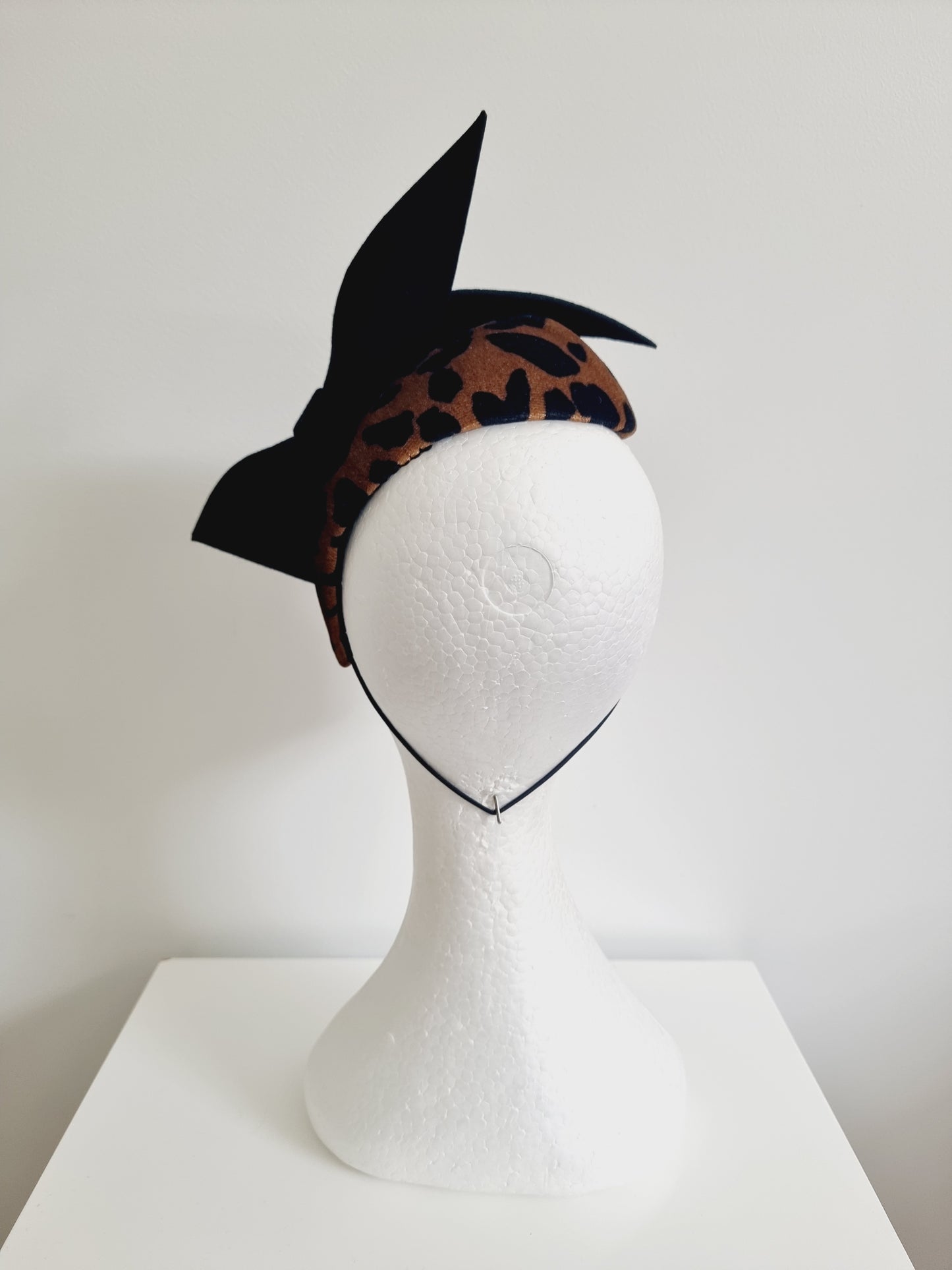 Miss Simba. Womens animal print fascinator with black felt bow