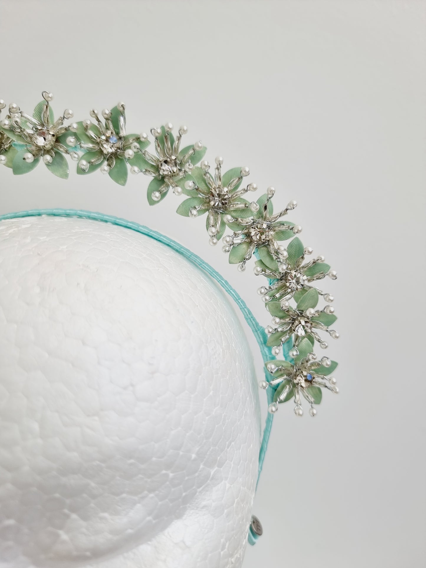 Miss Kiara. Womens flower headband fascinator in Mint Green