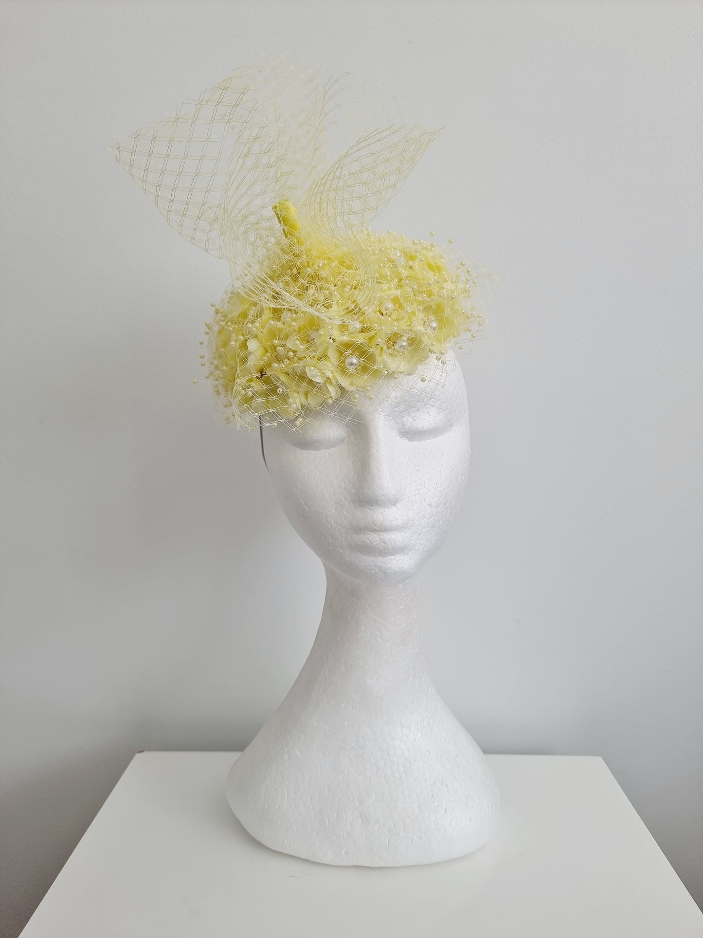 Miss Tuttu. Womens pale lemon flower button with netting