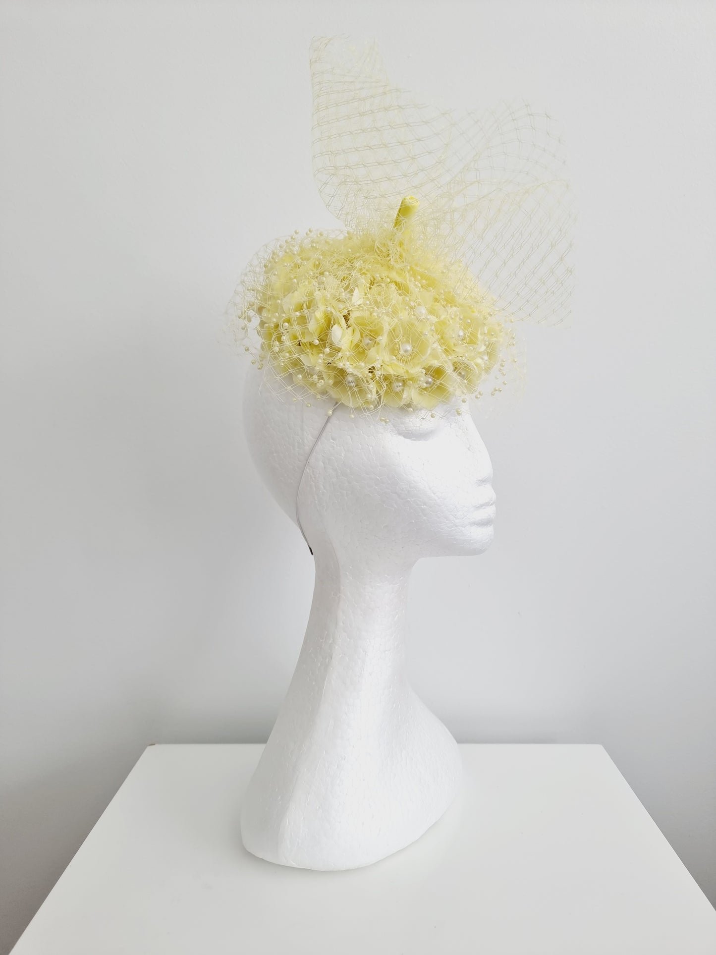 Miss Tuttu. Womens pale lemon flower button with netting