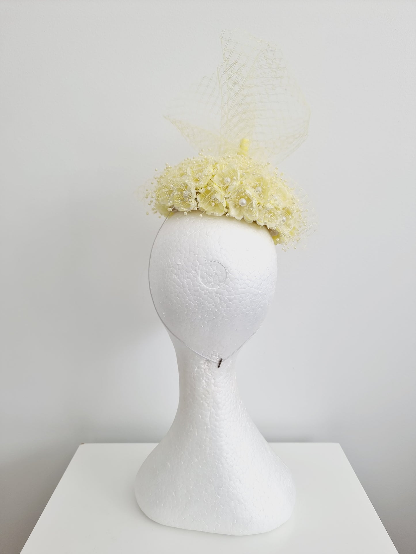 Miss Tuttu. Womens pale lemon flower button with netting