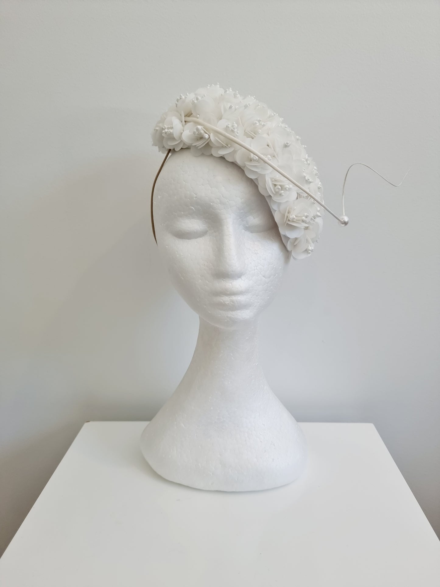 Miss Jamie . Womens White 3D flower encrusted fascinator with quill