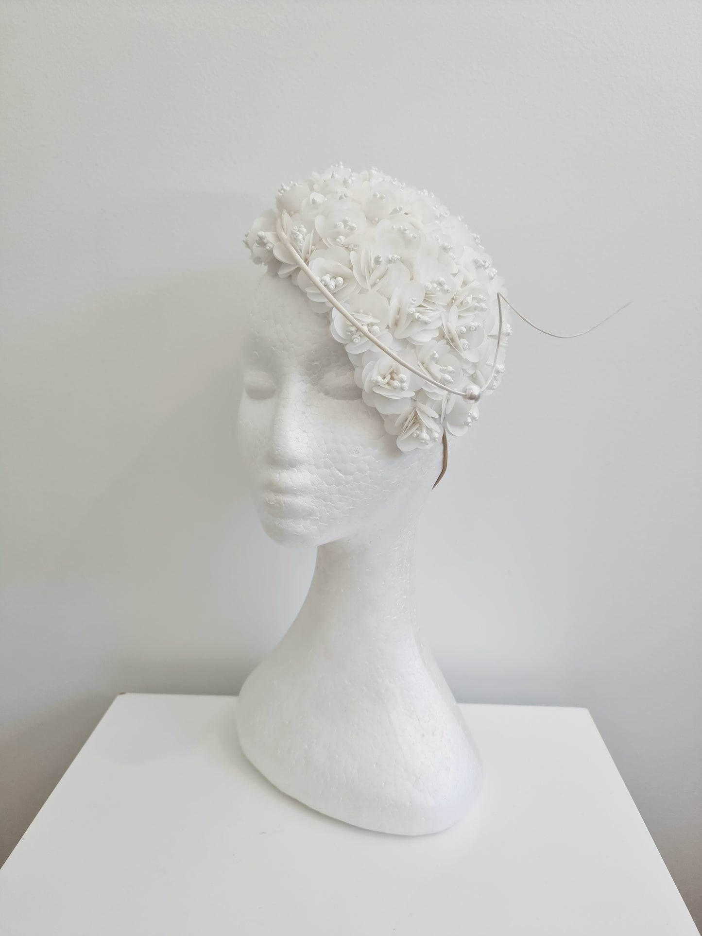 Miss Jamie . Womens White 3D flower encrusted fascinator with quill