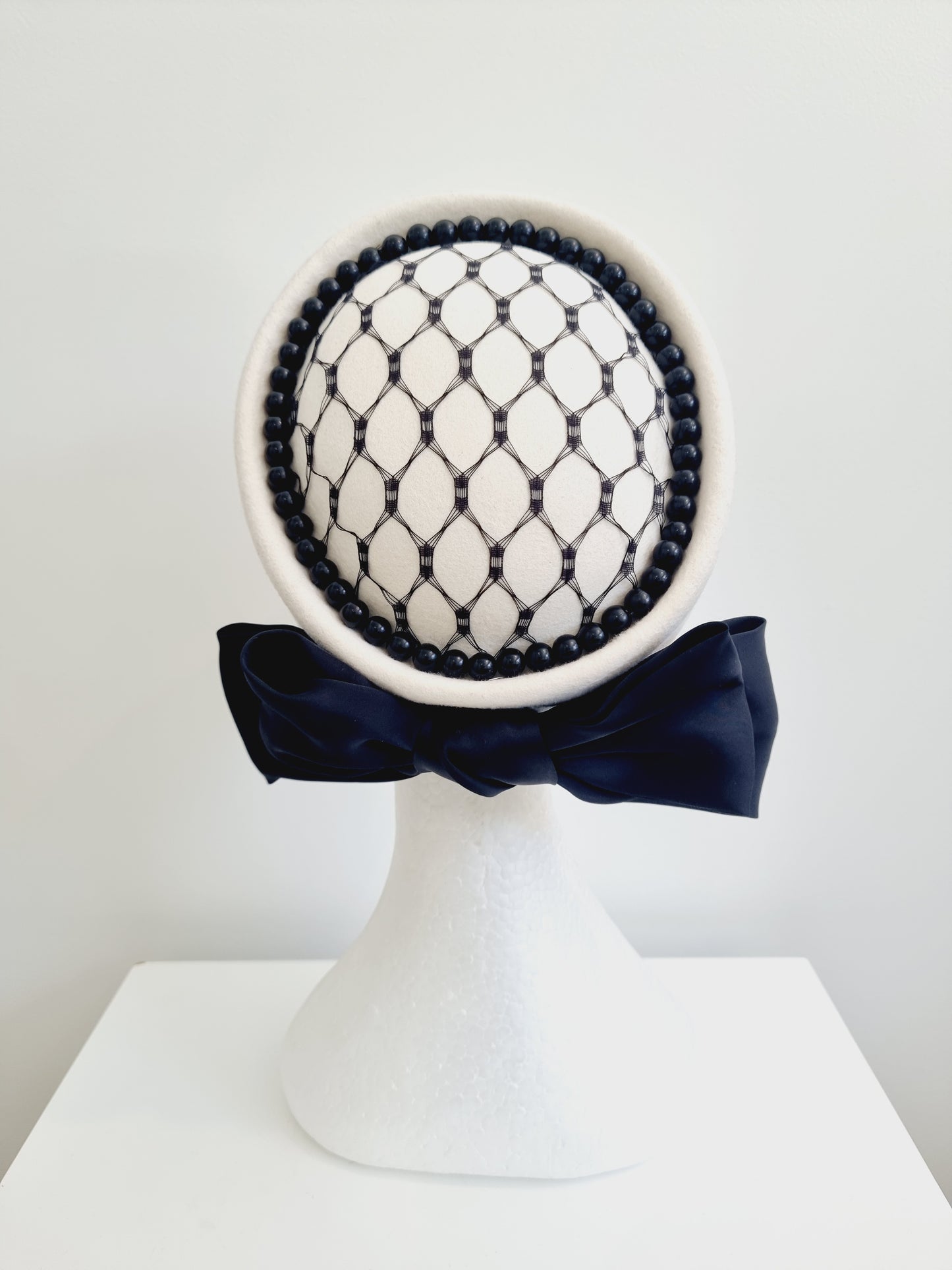 Miss Lavina. Womens Ivory pillbox headpiece with black detailing and bow