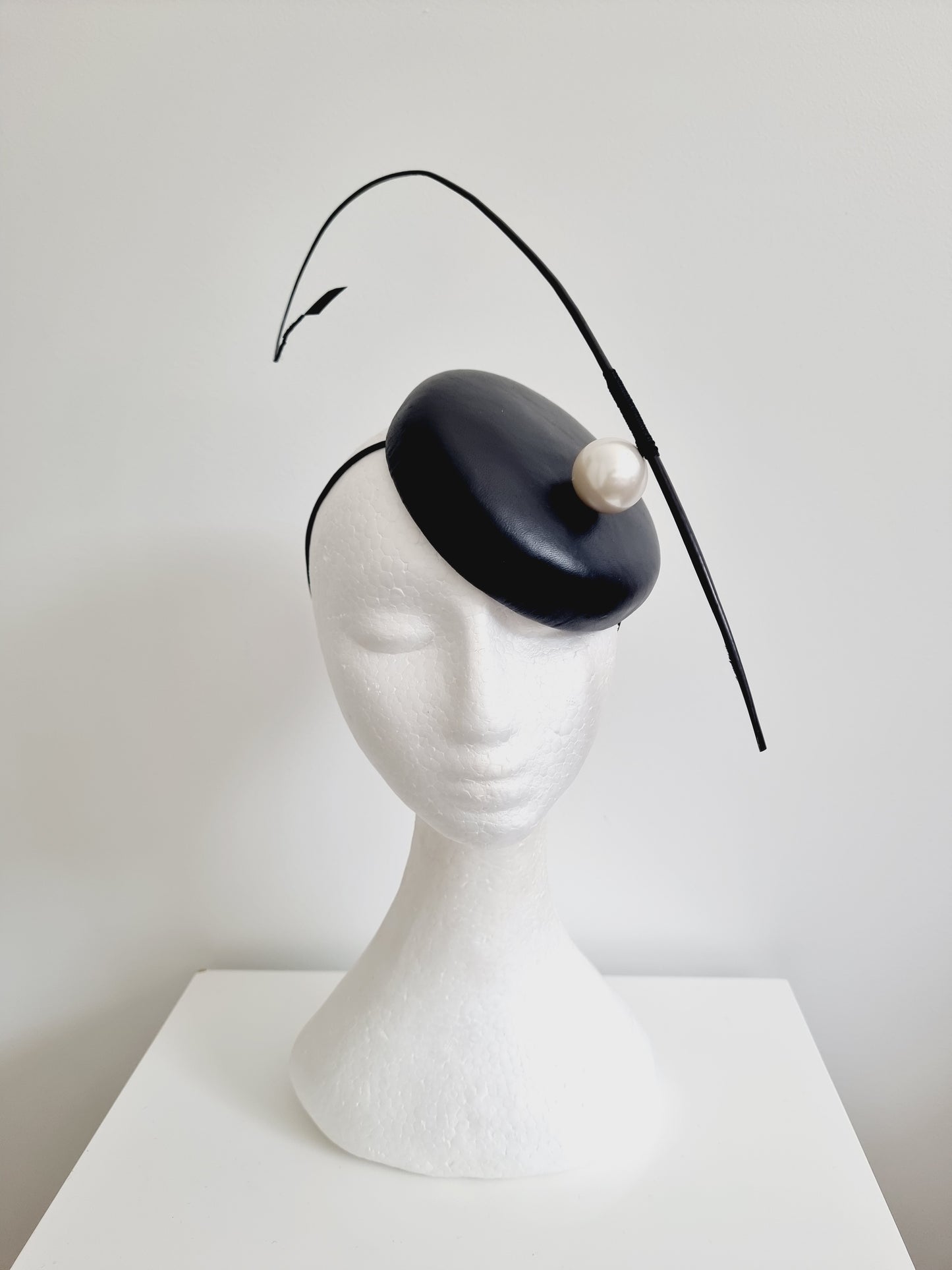 Miss Resolute. Womens Black leather button fascinator with pearl detail