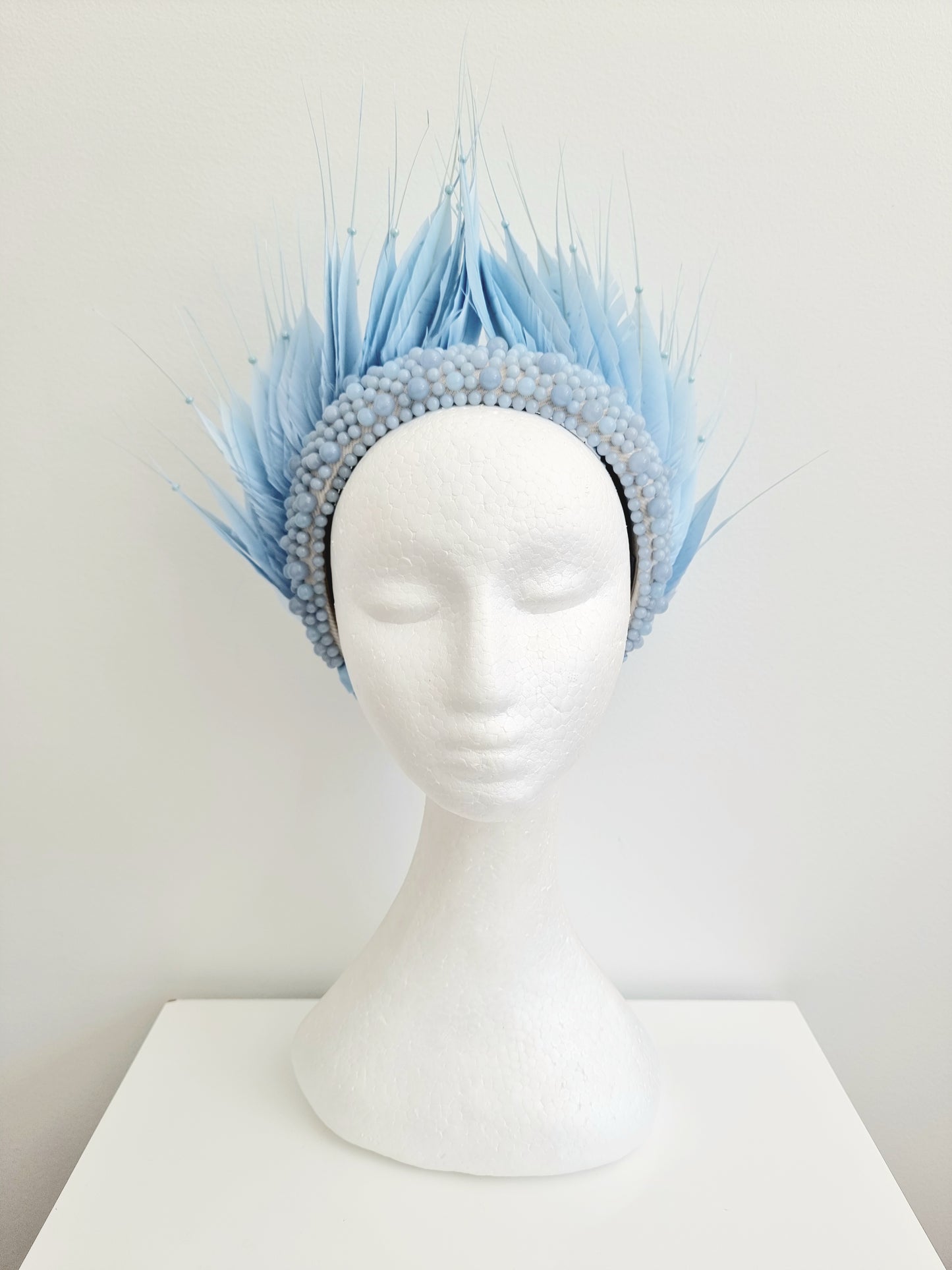 Miss Aldia. Womens Pale Blue pearl and feather headband fasinator