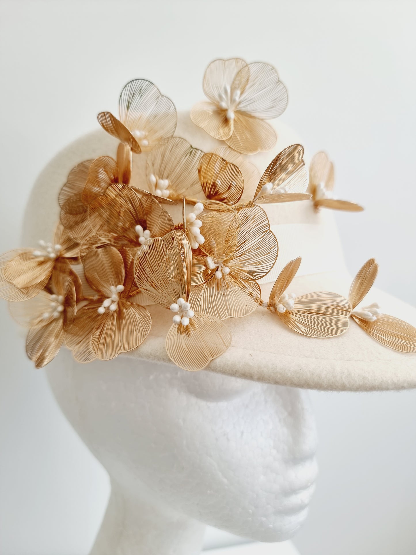 Miss Dominica. Womens Ivory wool felt cap with gold floral  detailing