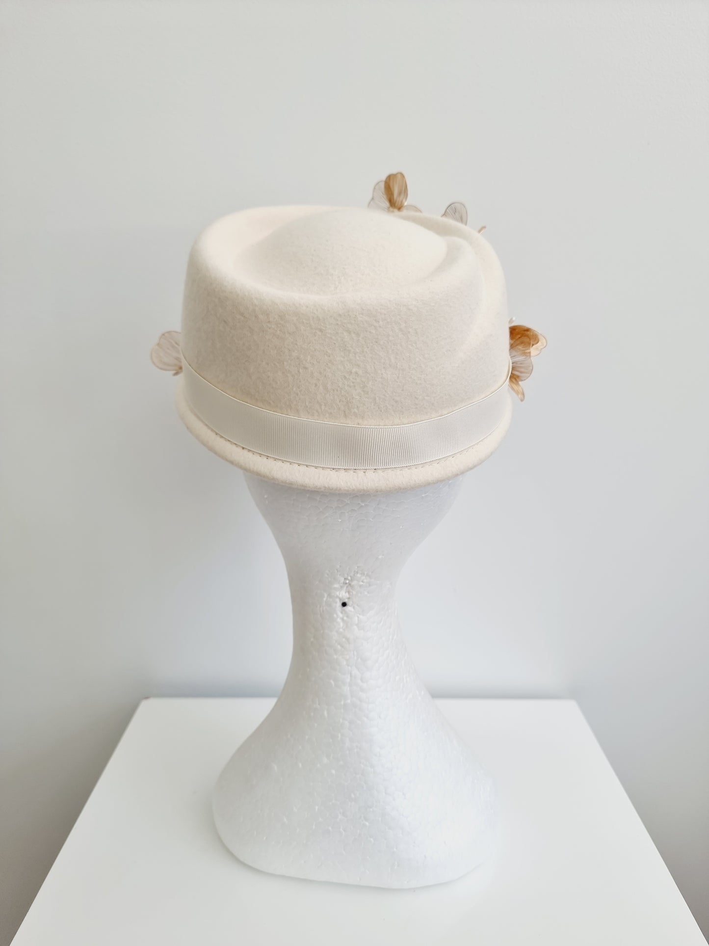 Miss Dominica. Womens Ivory wool felt cap with gold floral  detailing