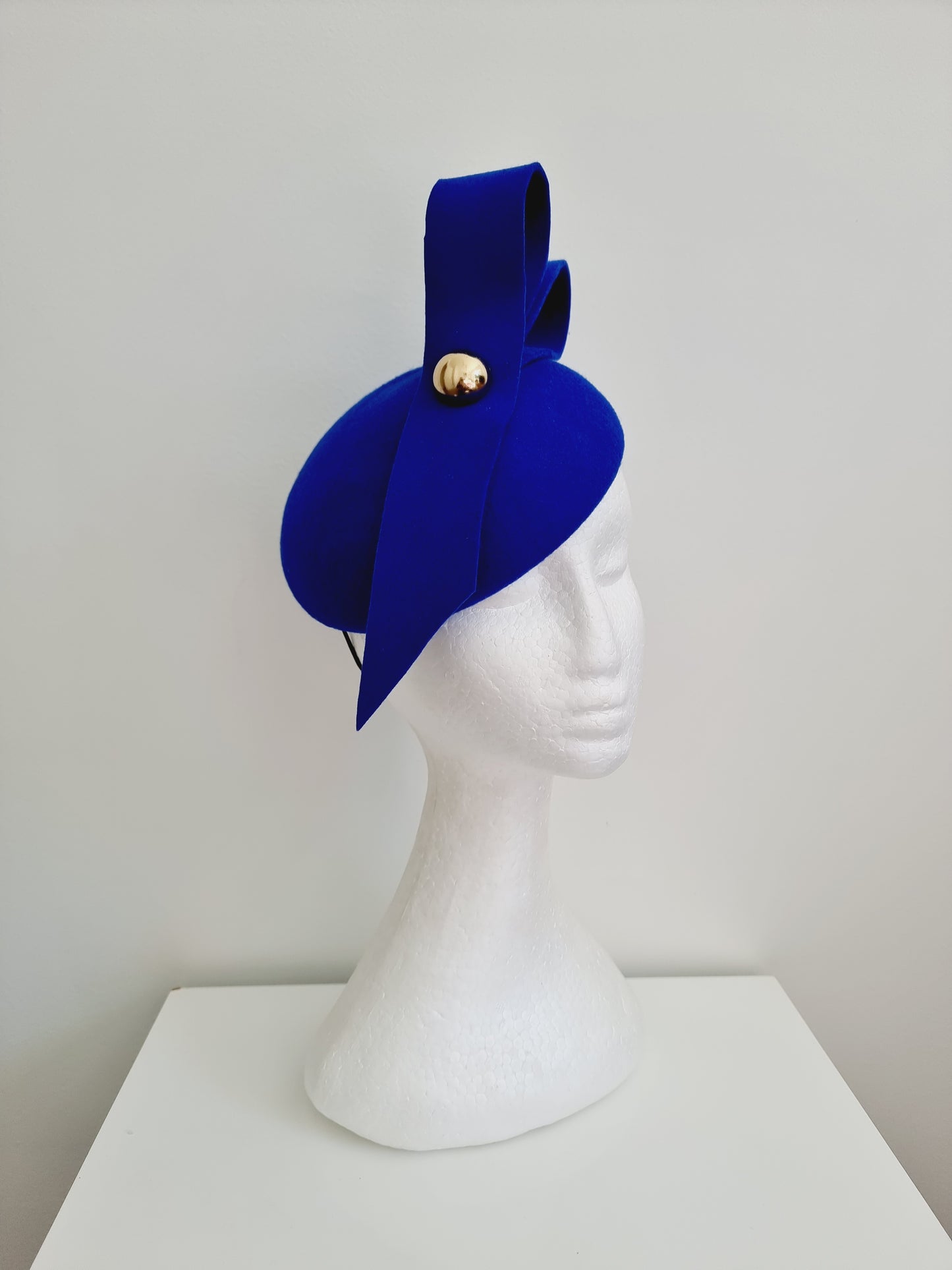 Miss Baker. Womens Royal Blue felt button fascinator with loops