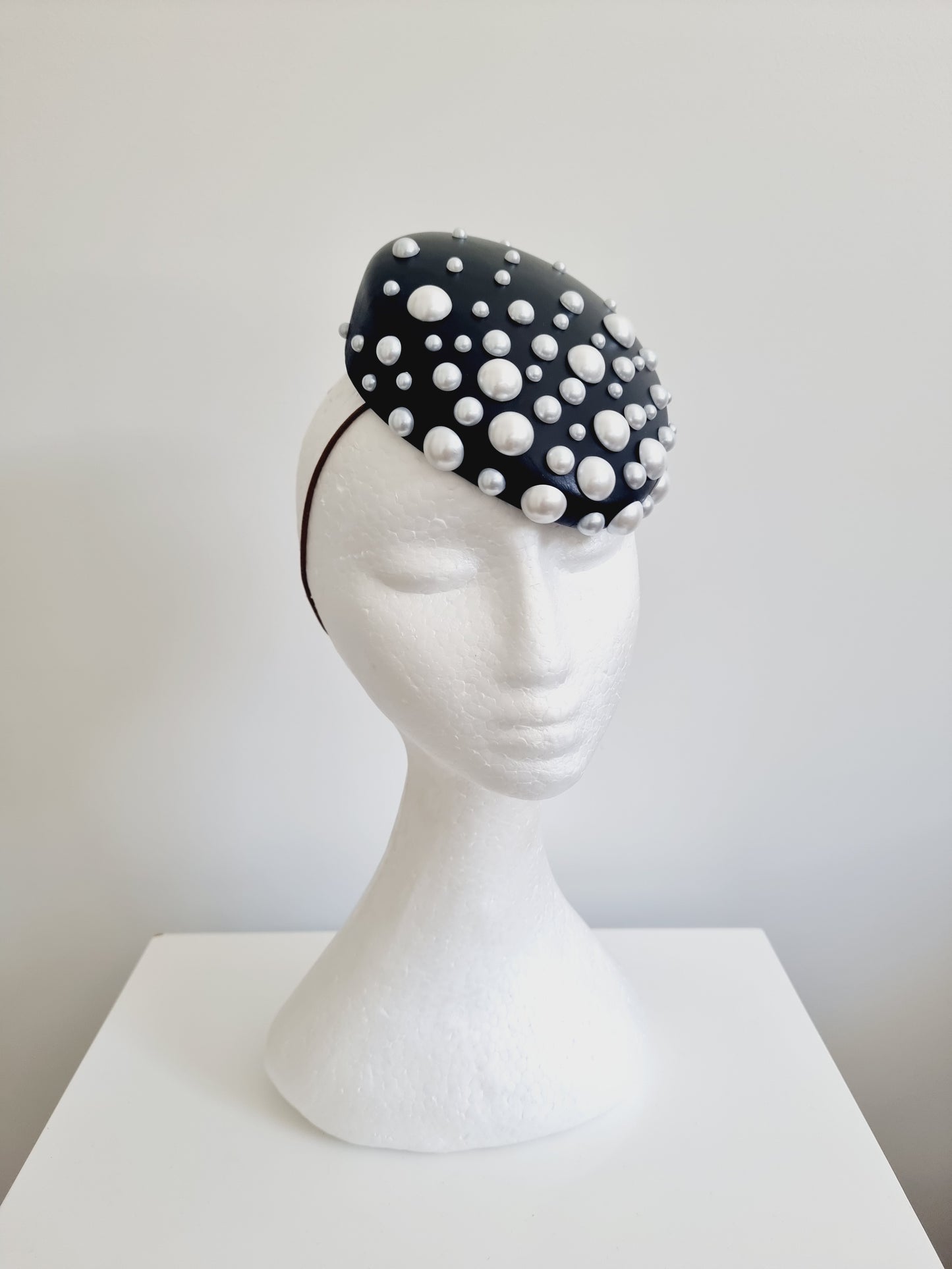 Miss Kefford. Womens Black slanted pillbox fascinator with pearls