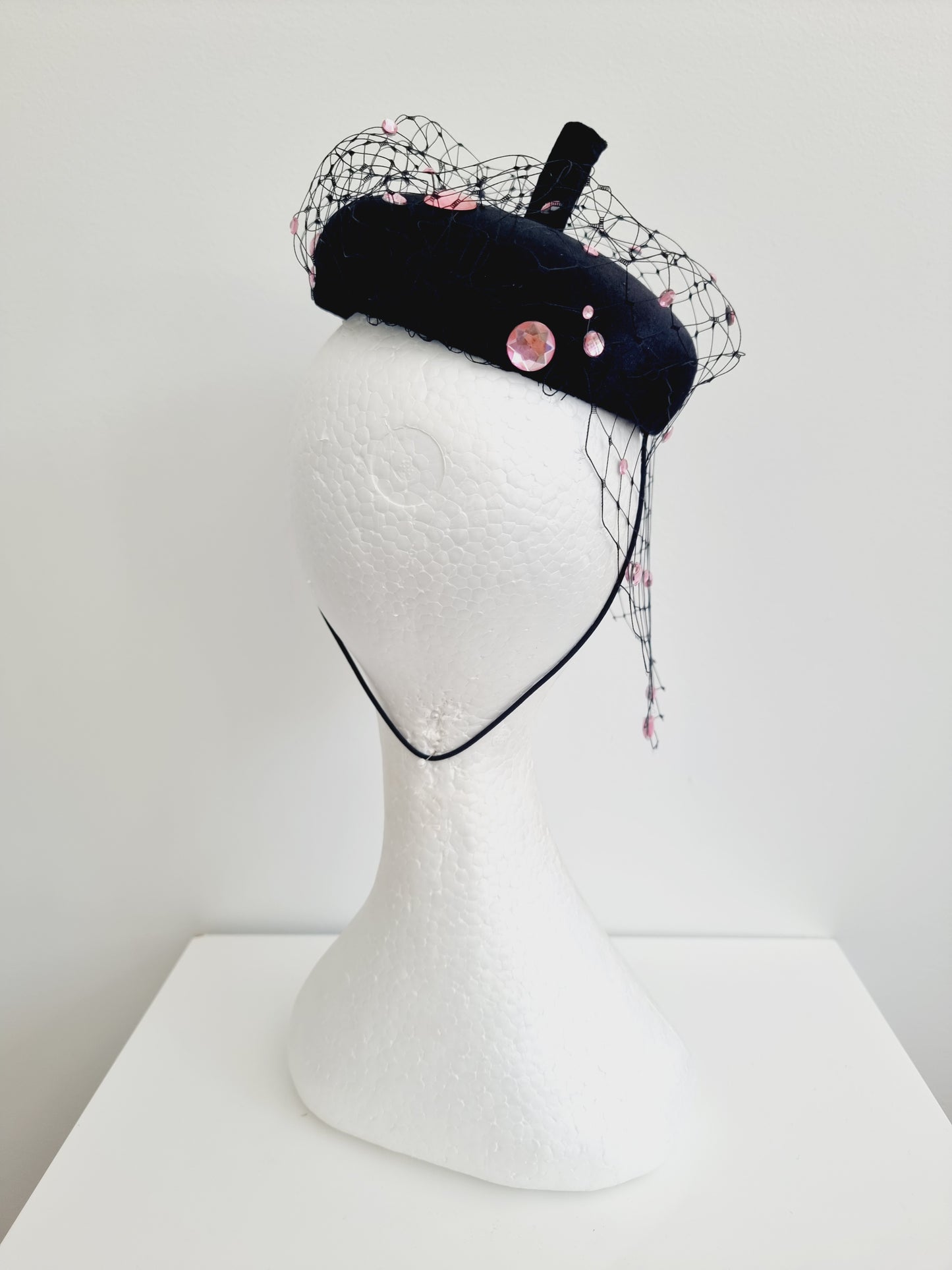 Miss Rue. Womens black velvet button fascinator with pink rhinestones and matching bag