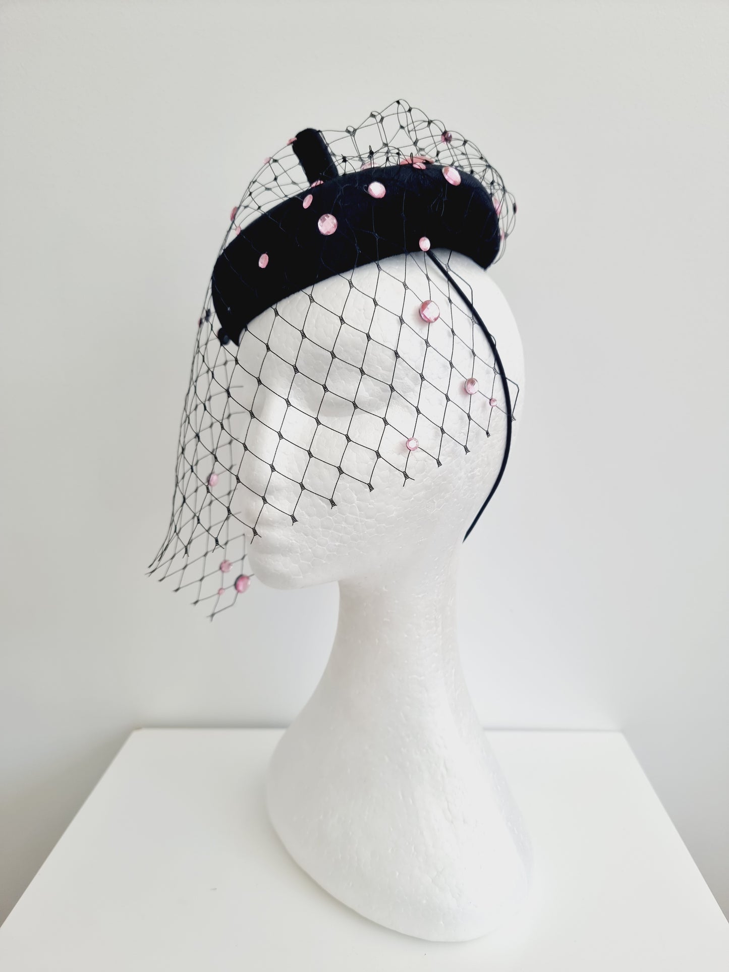 Miss Rue. Womens black velvet button fascinator with pink rhinestones and matching bag