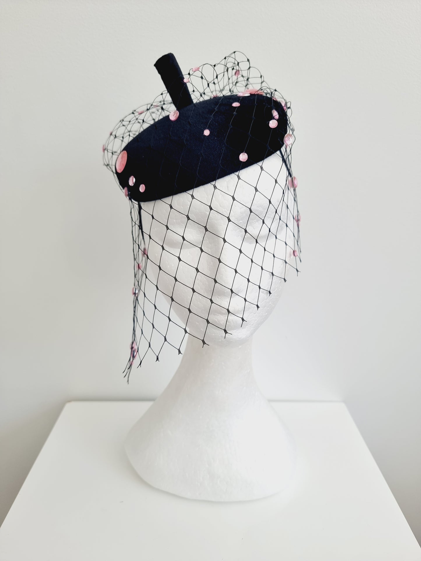 Miss Rue. Womens black velvet button fascinator with pink rhinestones and matching bag