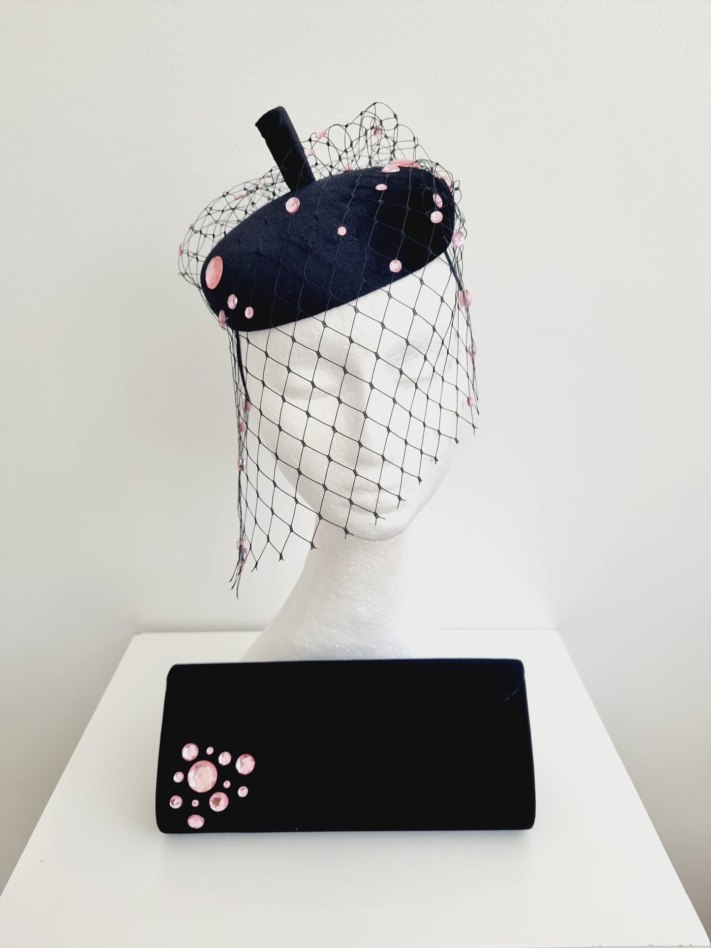 Miss Rue. Womens black velvet button fascinator with pink rhinestones and matching bag