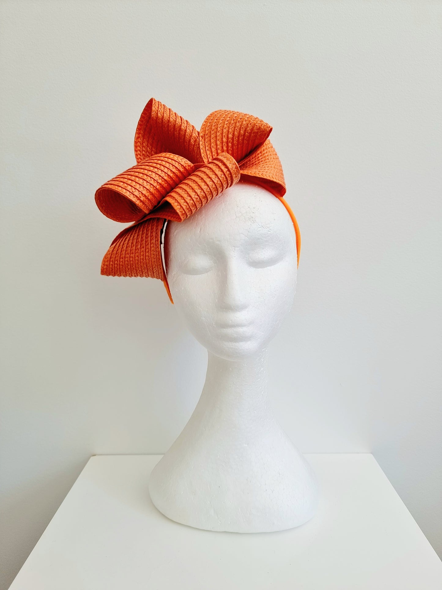 Miss Samantha. Womens braided loop fascinator in Orange