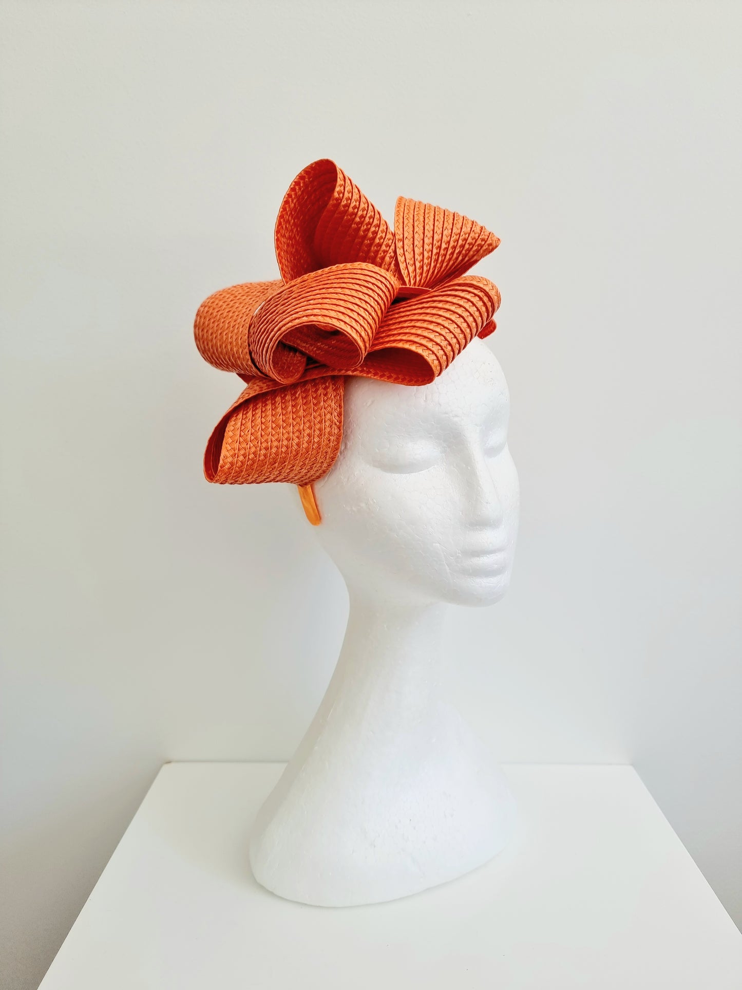 Miss Samantha. Womens braided loop fascinator in Orange