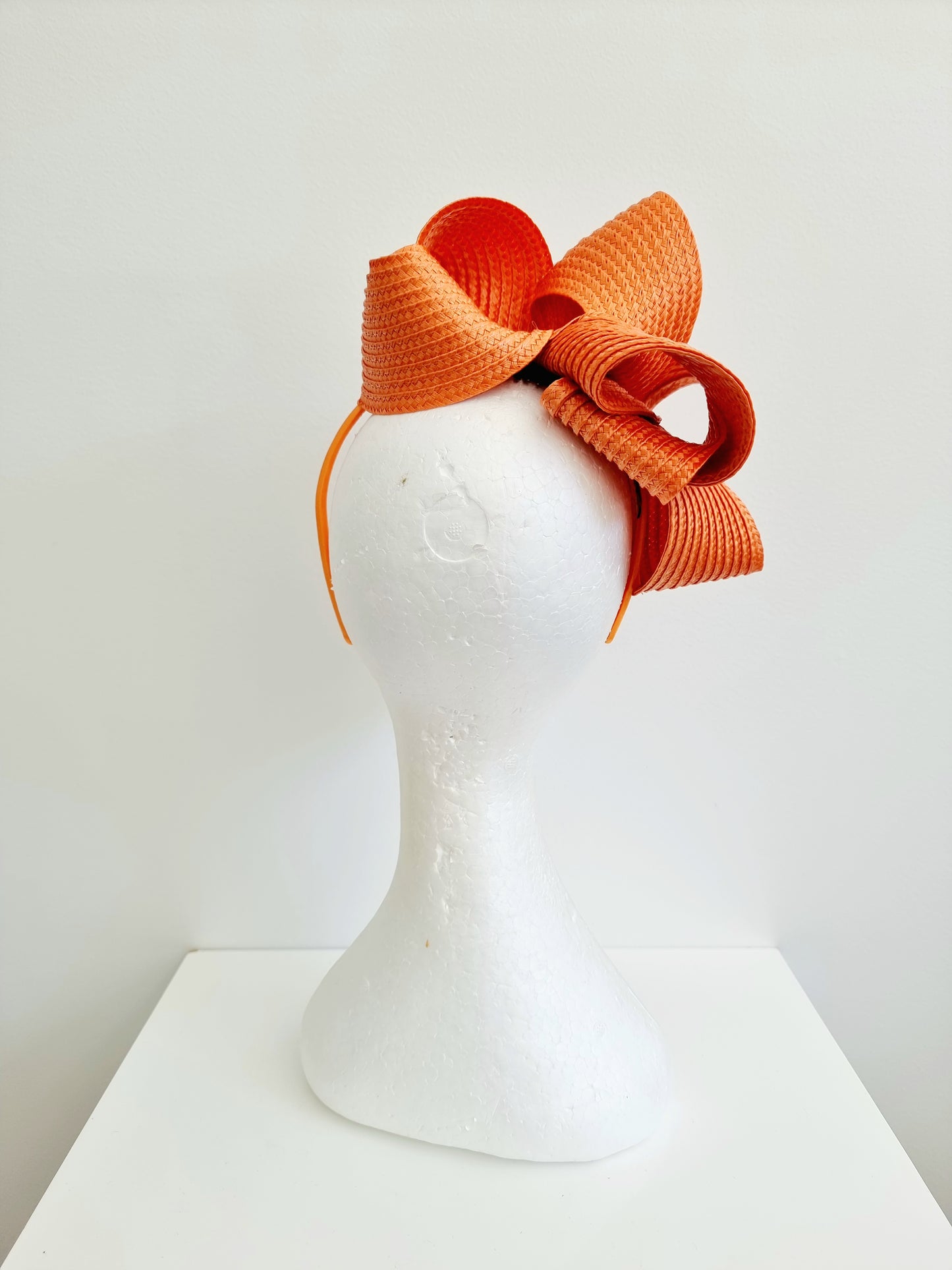 Miss Samantha. Womens braided loop fascinator in Orange