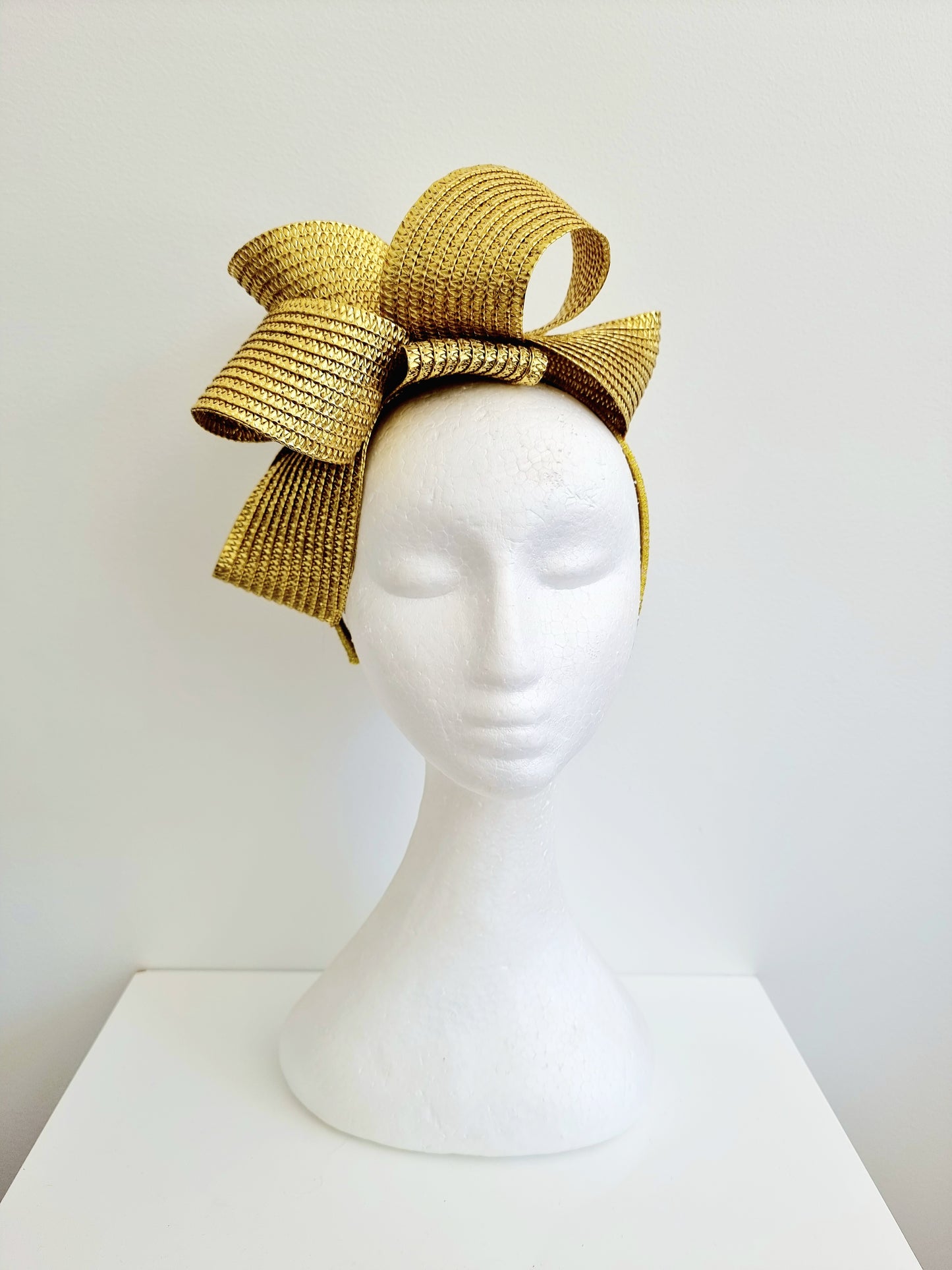 Miss Samantha. Womens braided loop fascinator in metallic gold