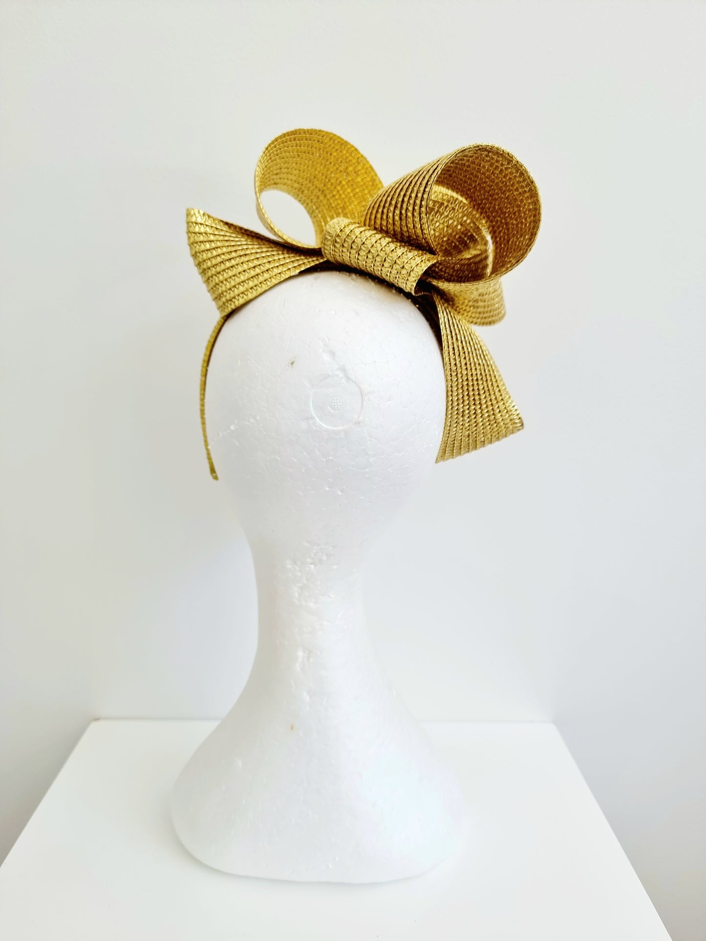 Miss Samantha. Womens braided loop fascinator in metallic gold