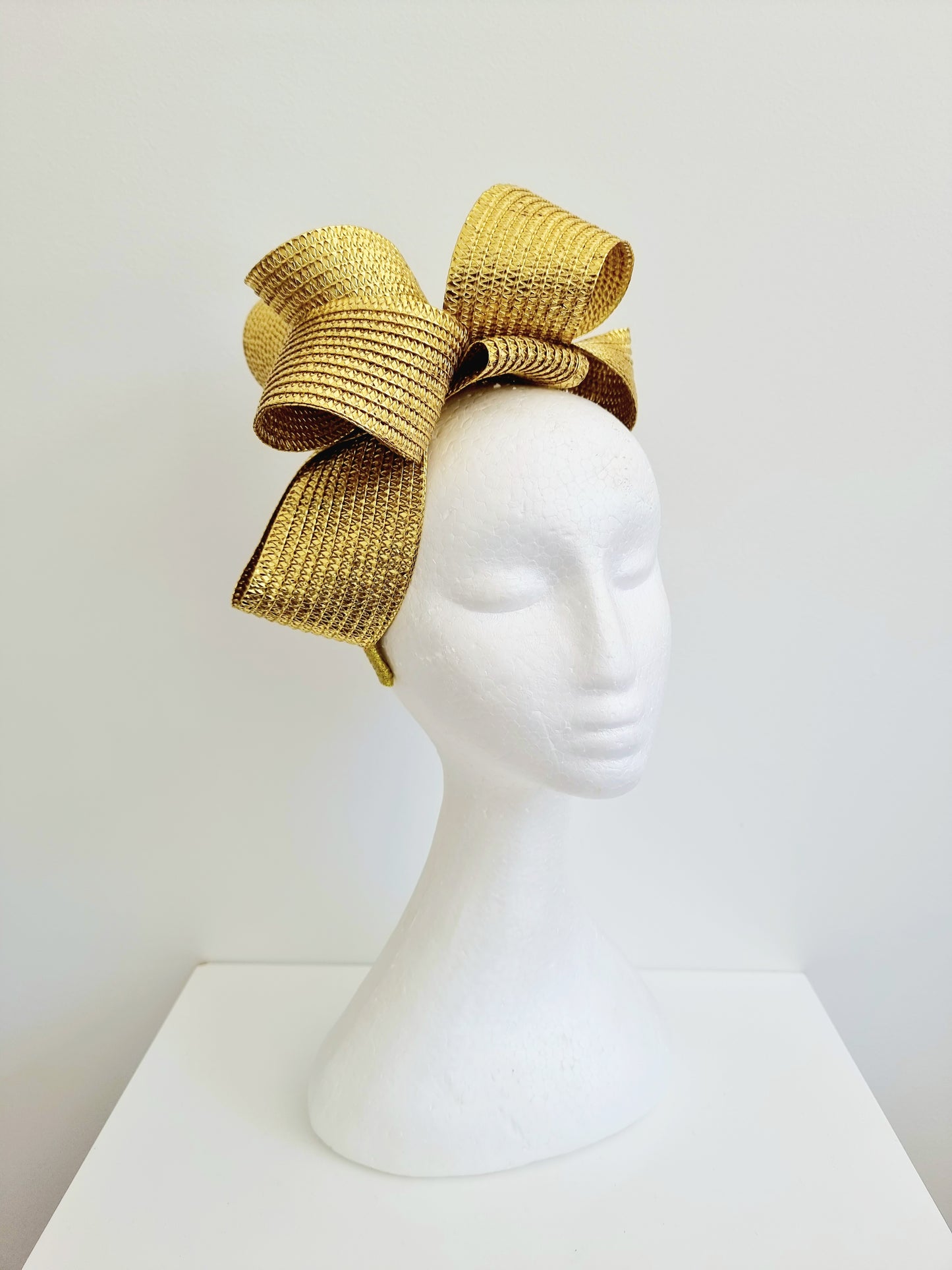 Miss Samantha. Womens braided loop fascinator in metallic gold