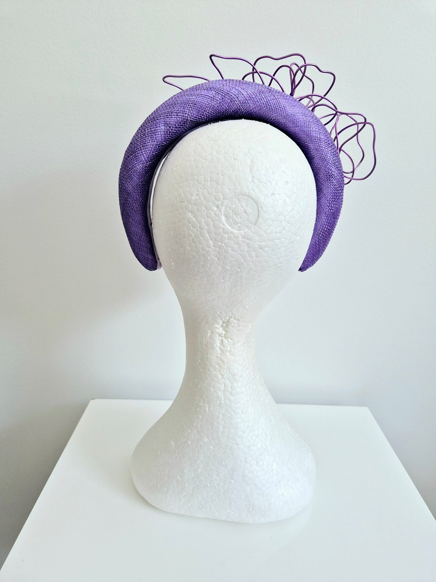 Miss Quinn. Womens Deep Lilac sinamay padded headband with wire flowers