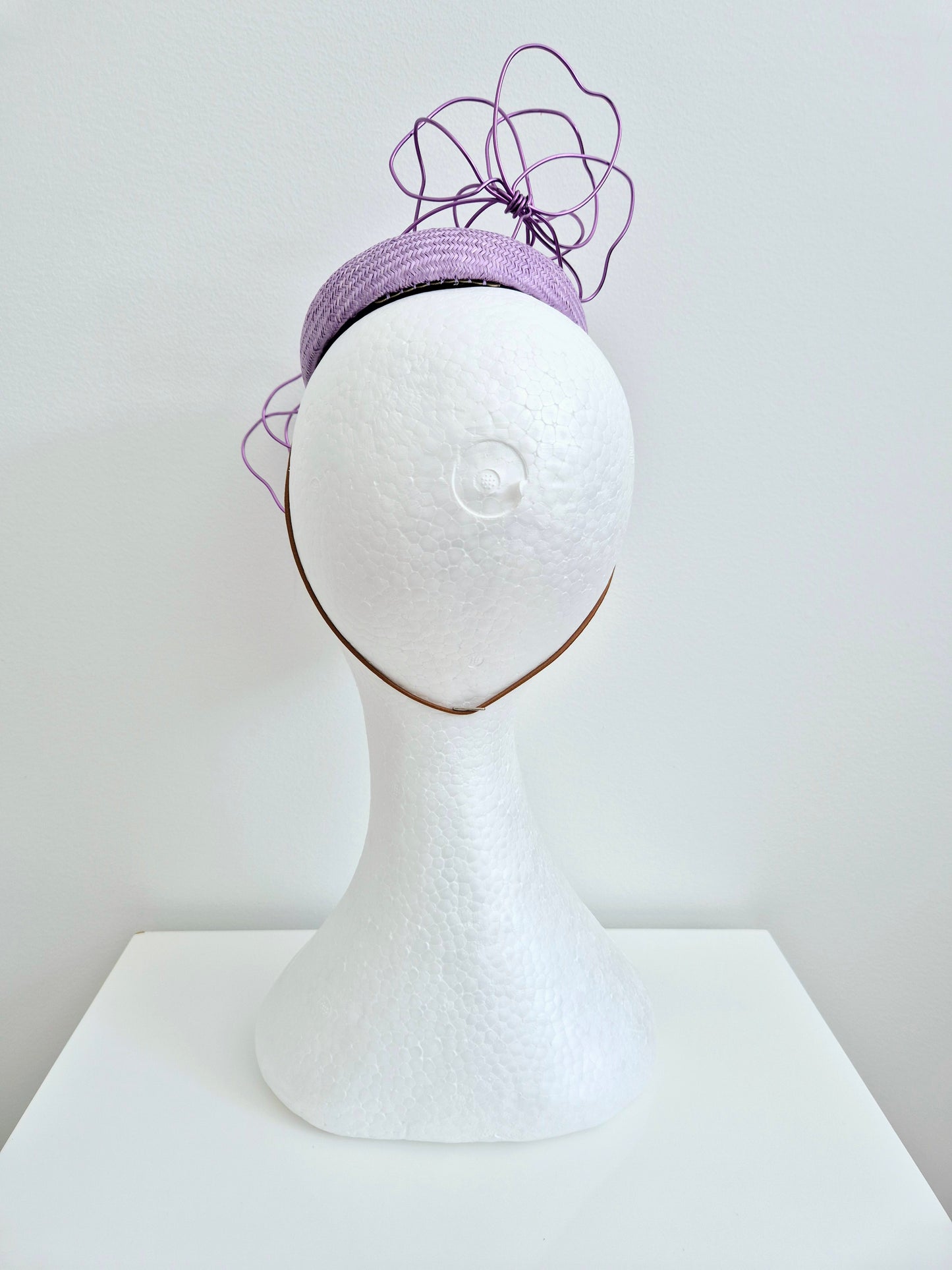 Miss Idalyee.  Womens lilac  button fascinator with purple wire flowers