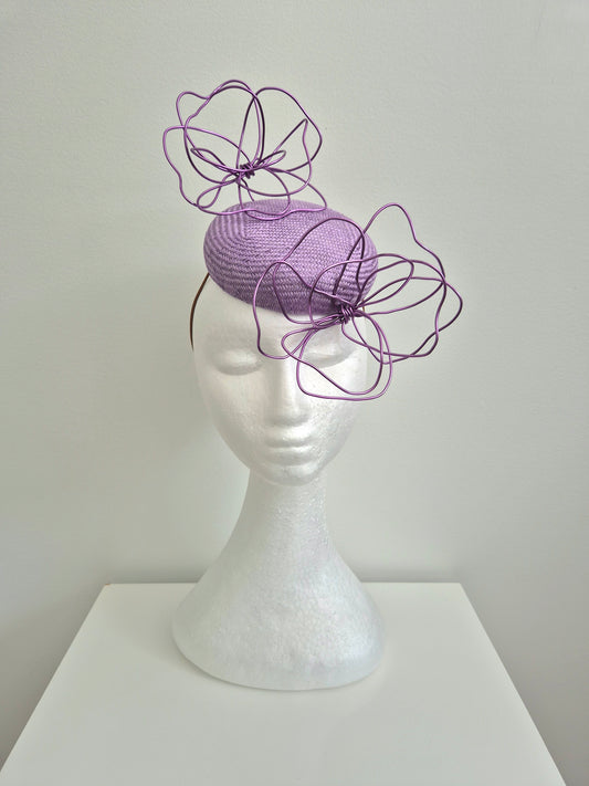 Miss Idalyee.  Womens lilac  button fascinator with purple wire flowers