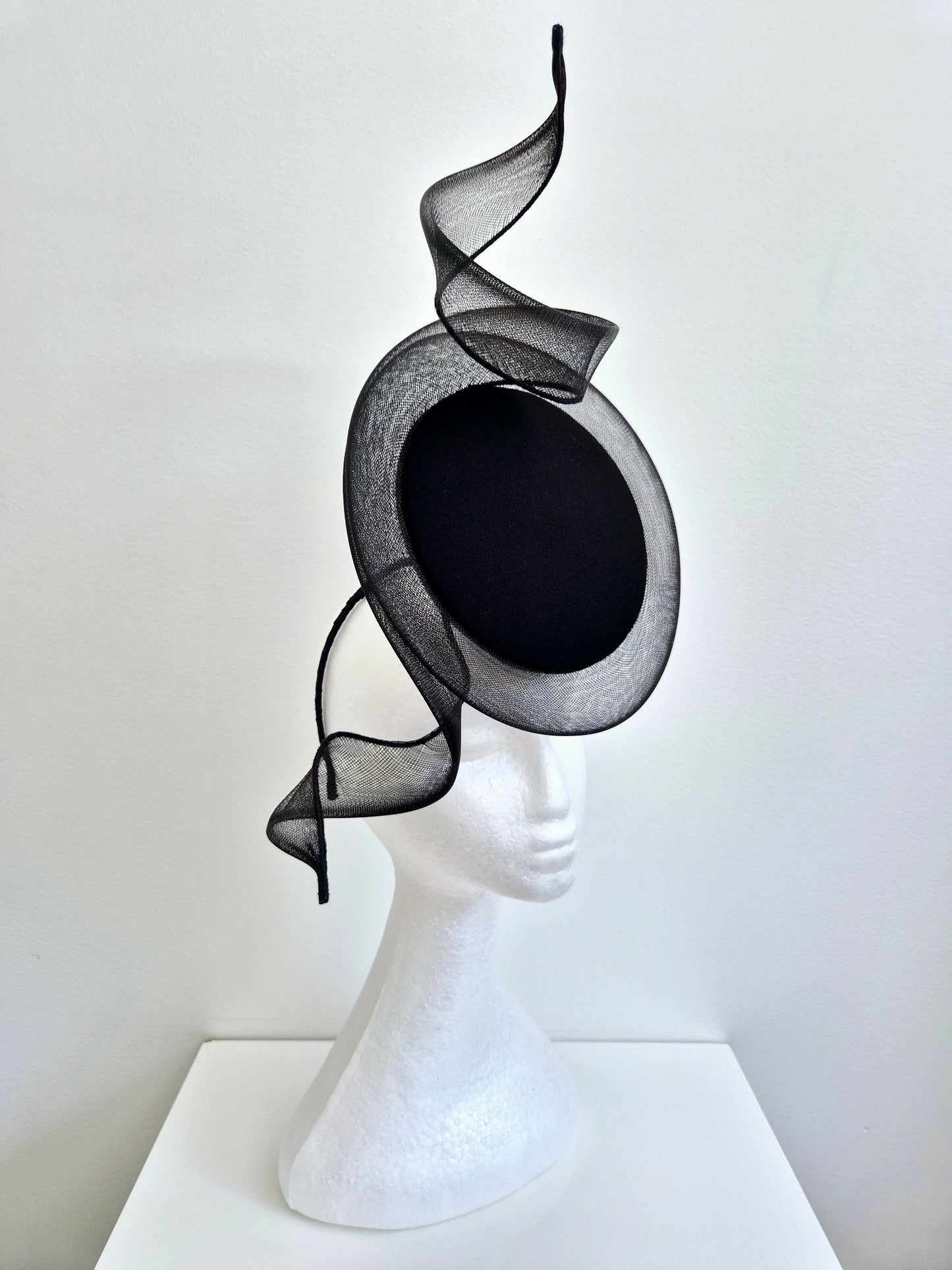 Miss Duke. Womens Black button percher headband fascinator with crinoline swirl