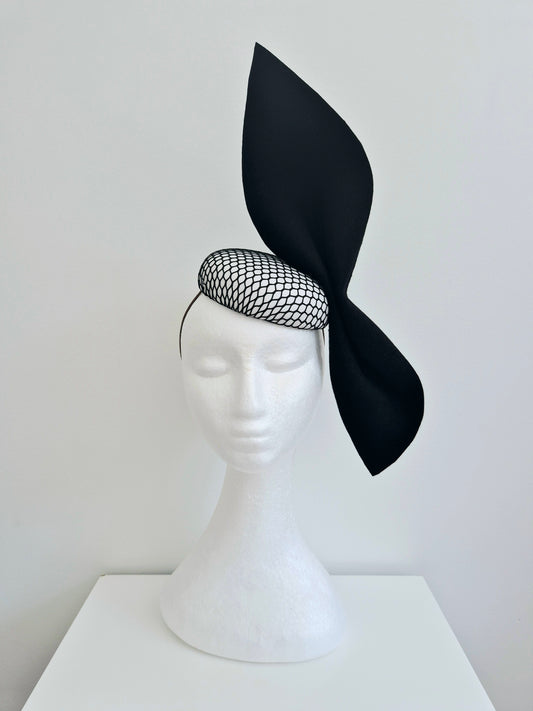 Miss Ester. Womens black and white button fascinator with felt bow