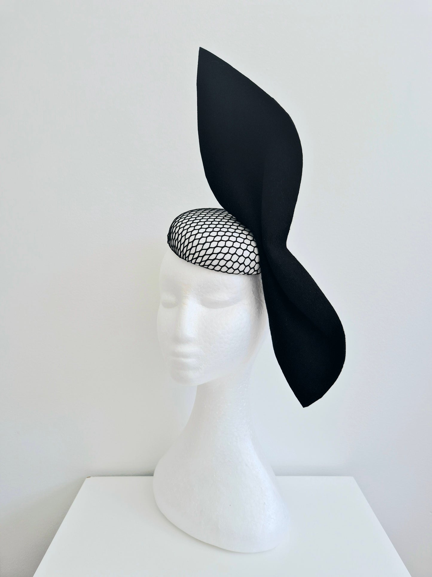 Miss Ester. Womens black and white button fascinator with felt bow