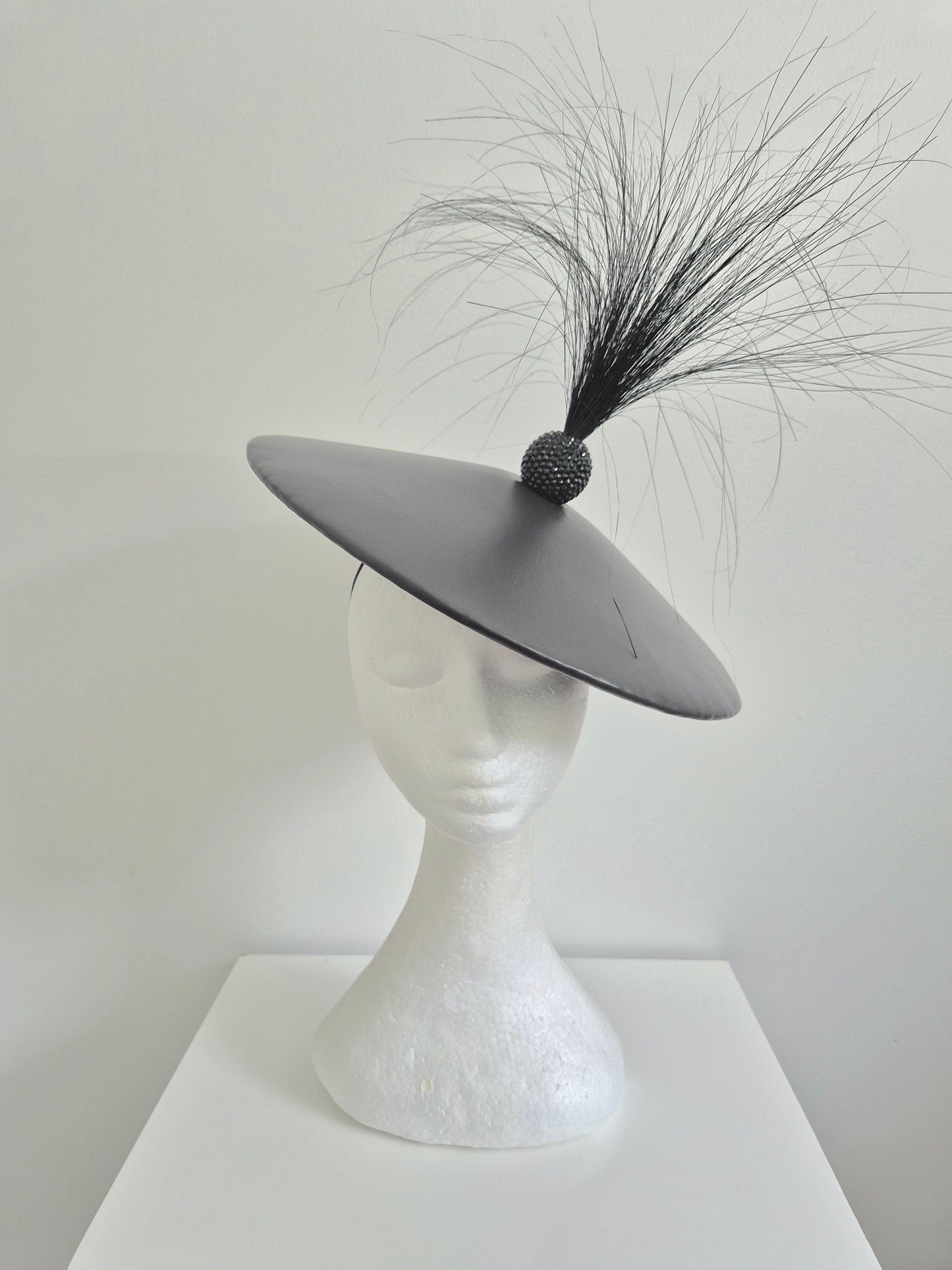 Miss Santos. Womens low coolie hat in black leather with rhinestone ball and herl