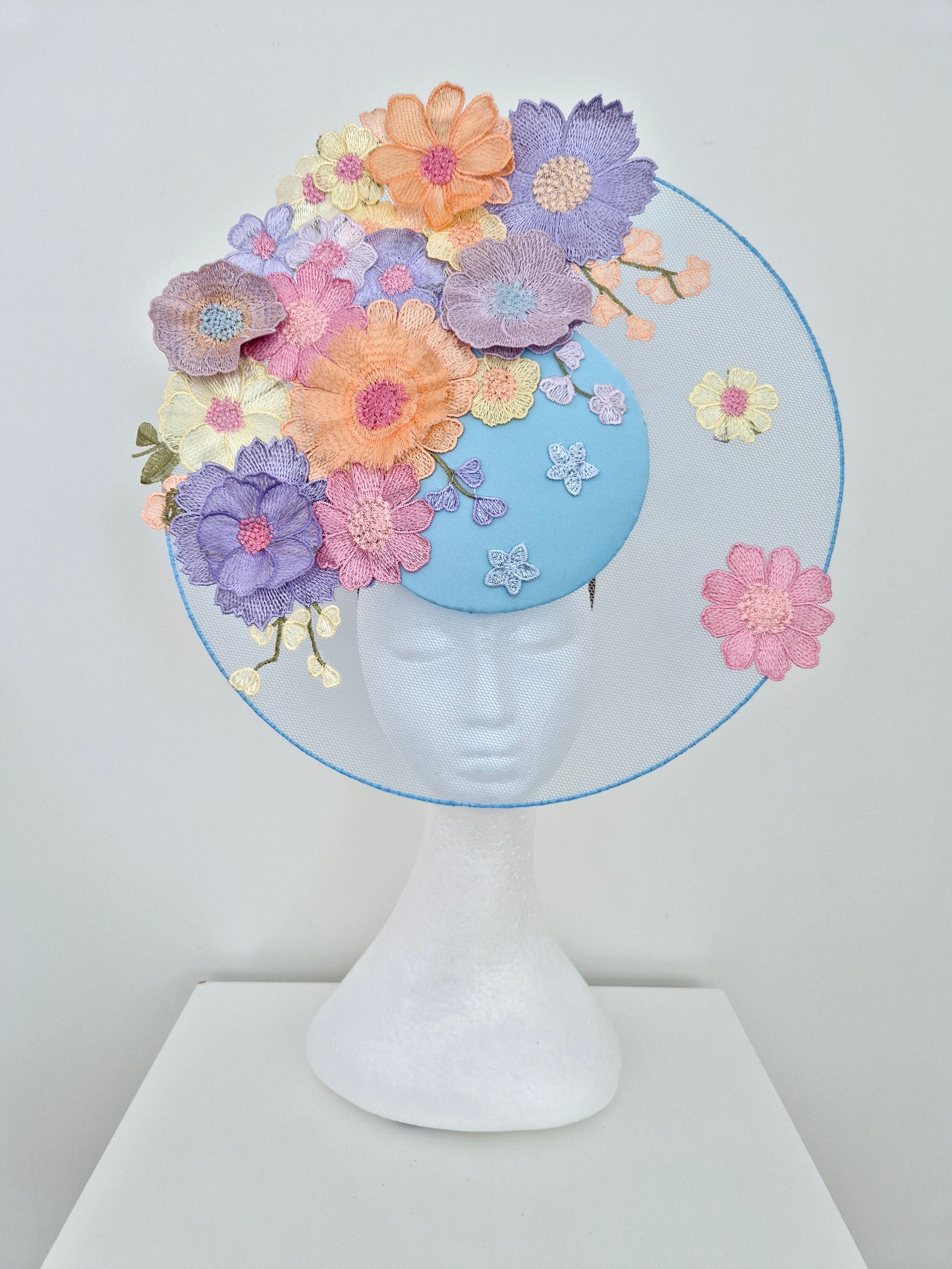 Miss Whimsical. Womens Light Blue satellite percher headband fascinator with pastel multi 3D flowers