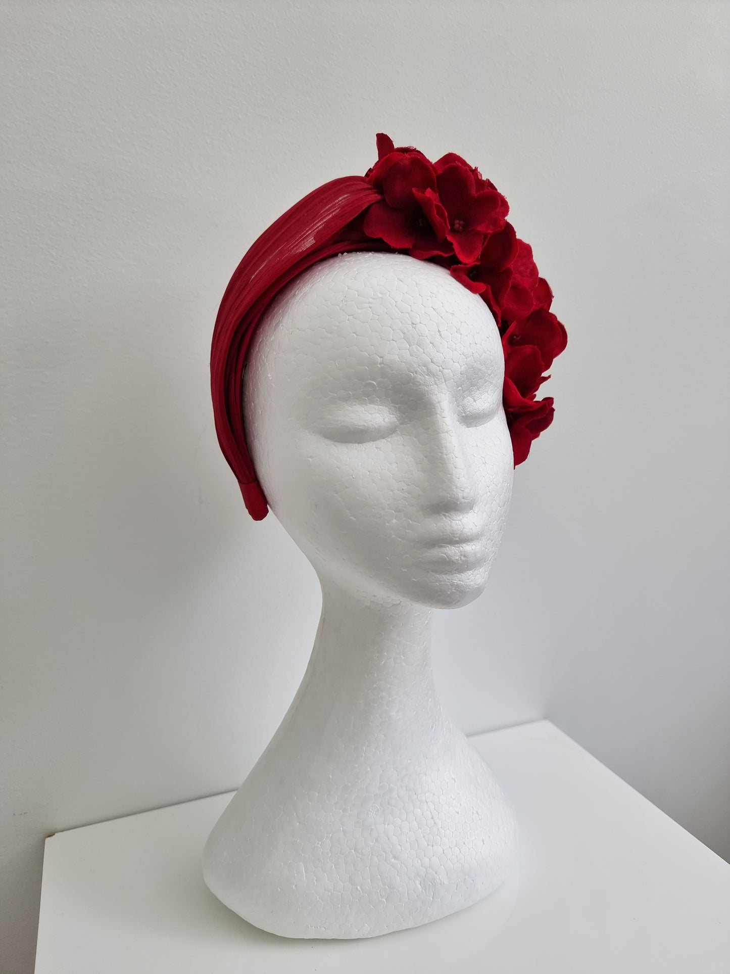 Miss Lucille. Womens deep red silk twist top headband with flower detail