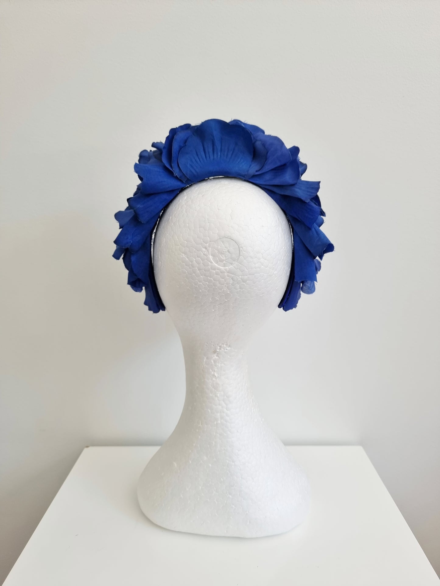 Miss Trixie. Womens ruffle embellished headband with veiling in Royal Blue