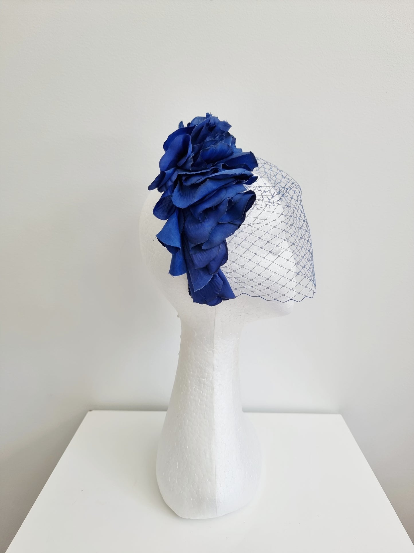 Miss Trixie. Womens ruffle embellished headband with veiling in Royal Blue