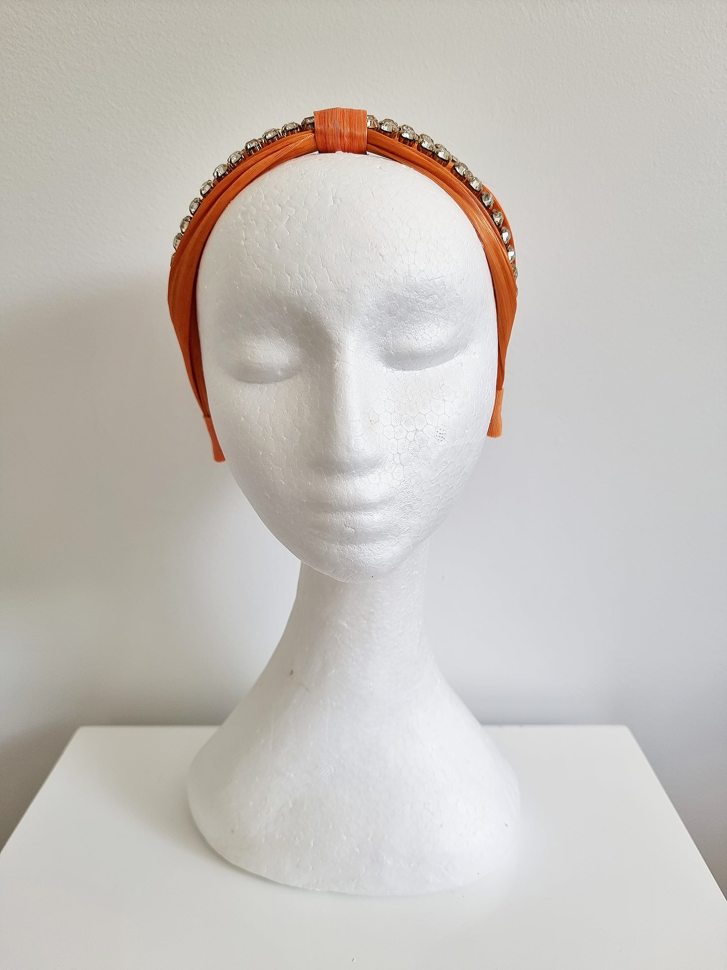 Miss Stella. Womens Orange silk and rhinestone embellished headband