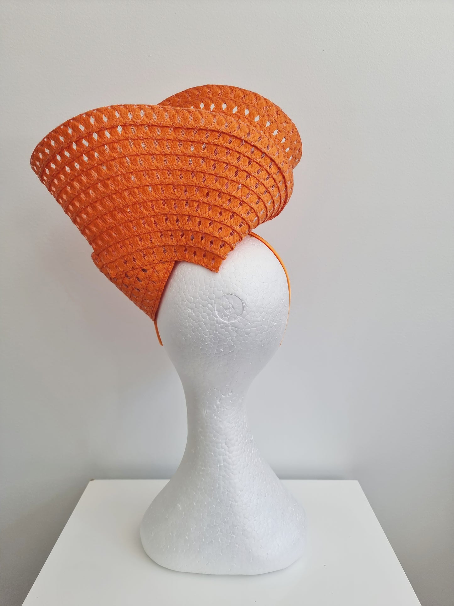 Miss Tara. Womens braided headband fascinator in Orange