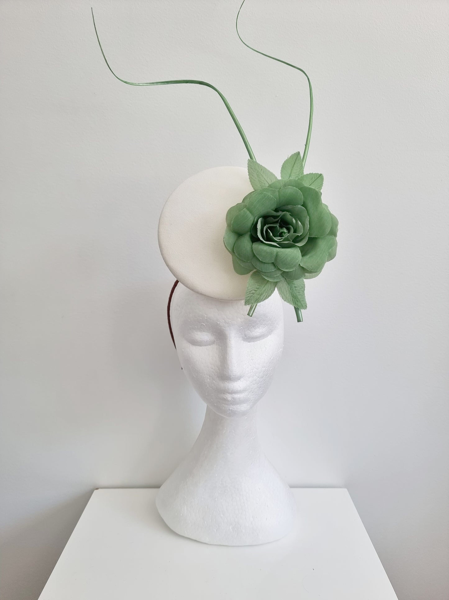 Miss Kendra. Womens ivory percher headband fascinator with fern green rose