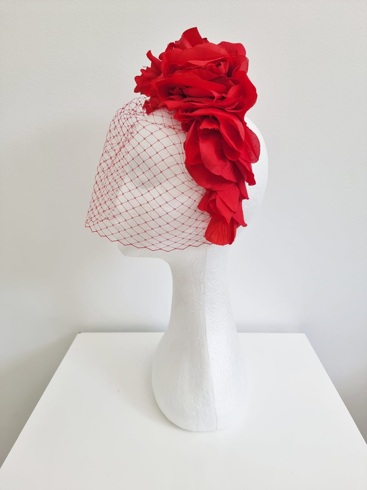 Miss Trixie. Womens ruffle embellished headband with veiling in Red
